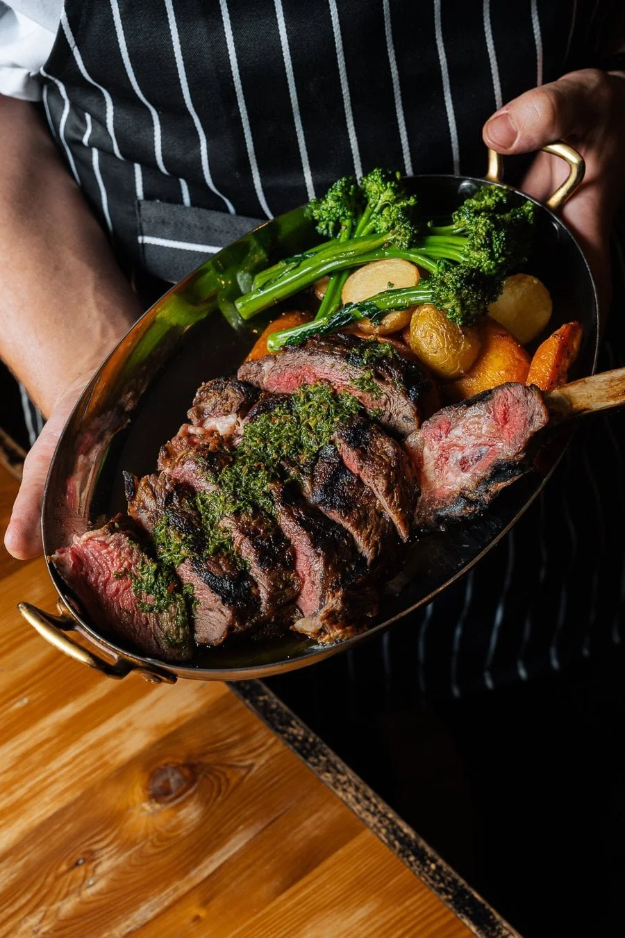Rockwall's pasture raised Tasmanian rib eye steak with chimmichurri, roasted rosemary potatoes, carrot's & broccollini.