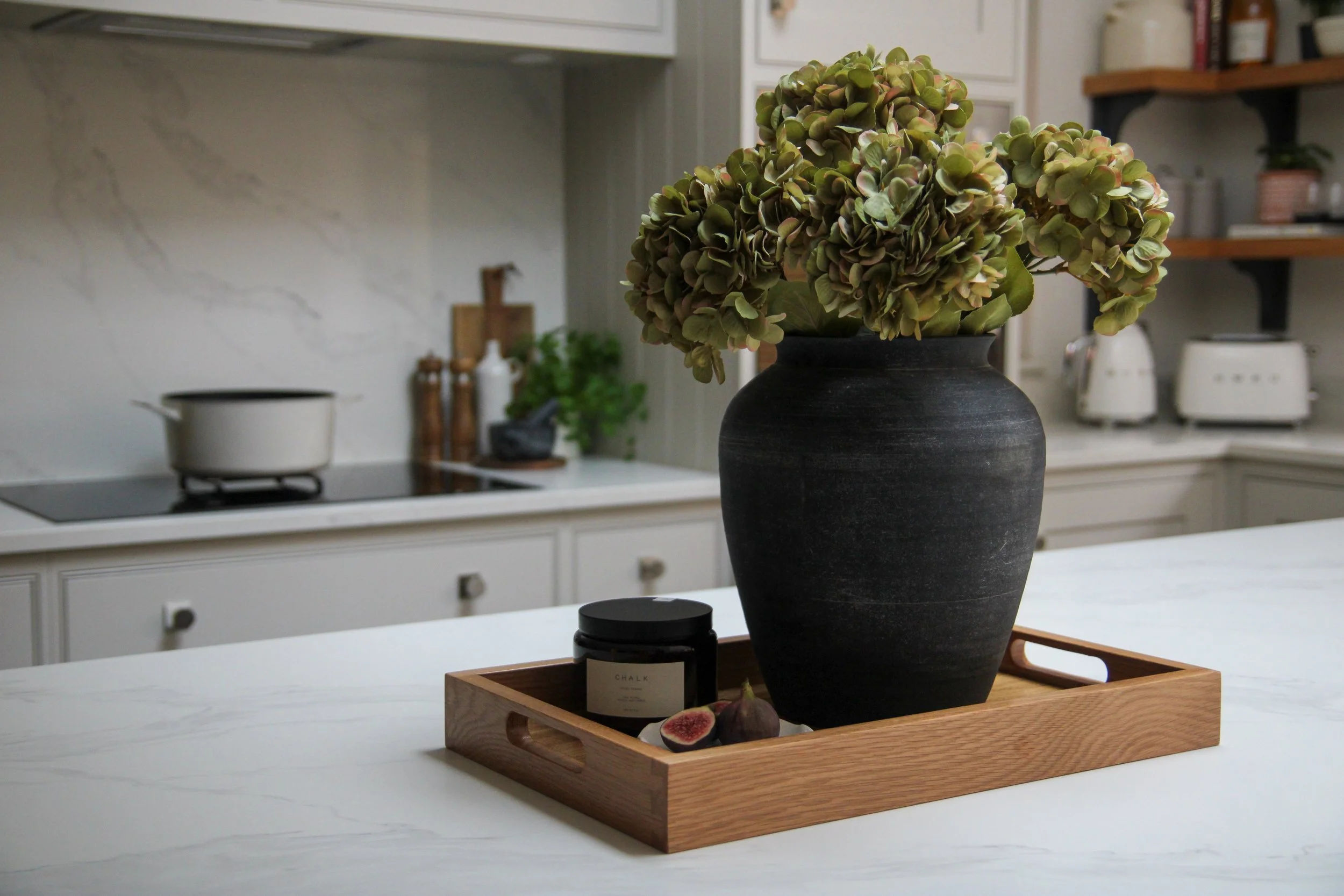Kitchen island styled with dried hydrangeas and decorative accessories