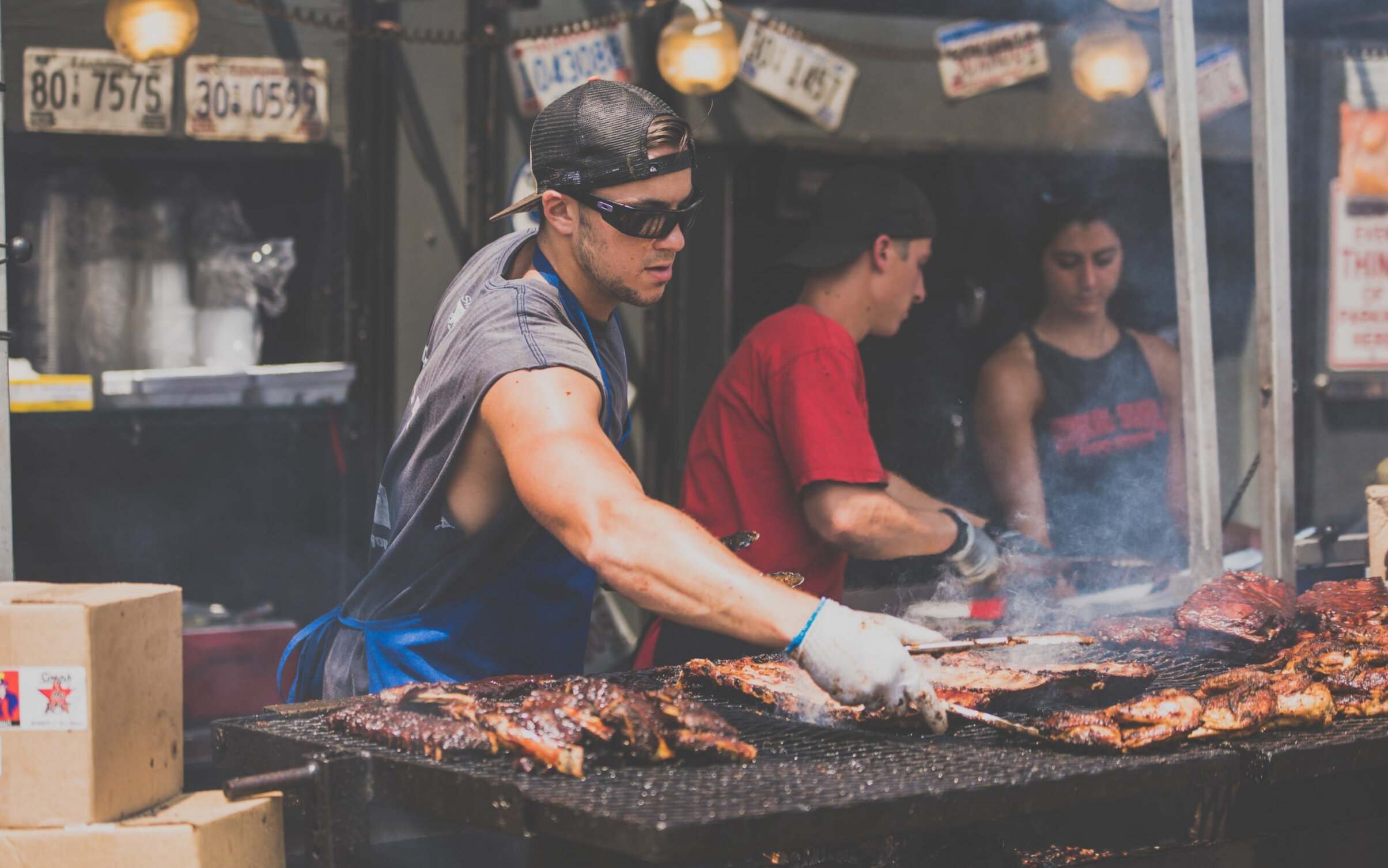 A barbecue pitmaster at work.
