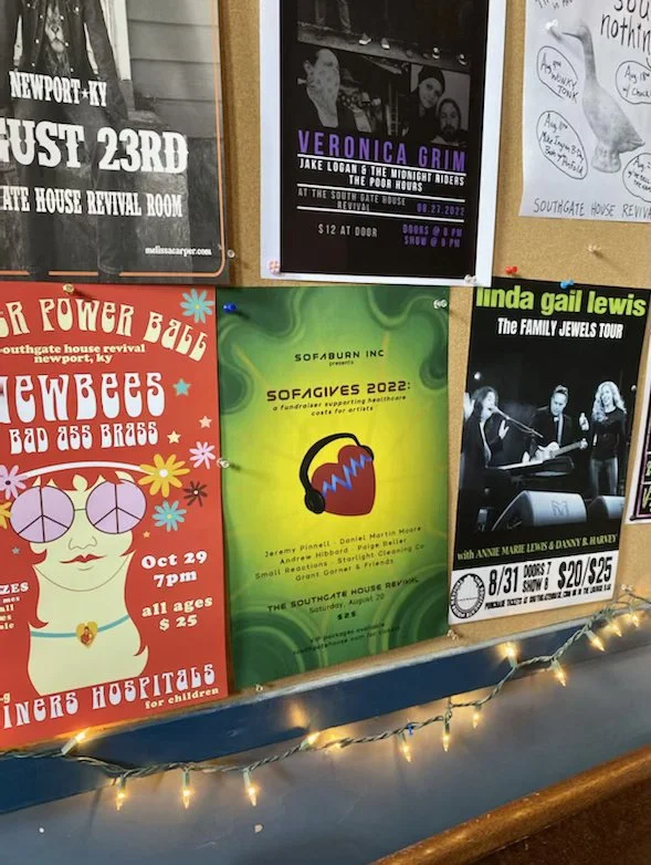 SOFAGIVES 2022 poster hanging out with its contemporaries in Cincinnati, OH. Sofaburn Inc. subsidizes healthcare costs for musicians, look them up and love on them!