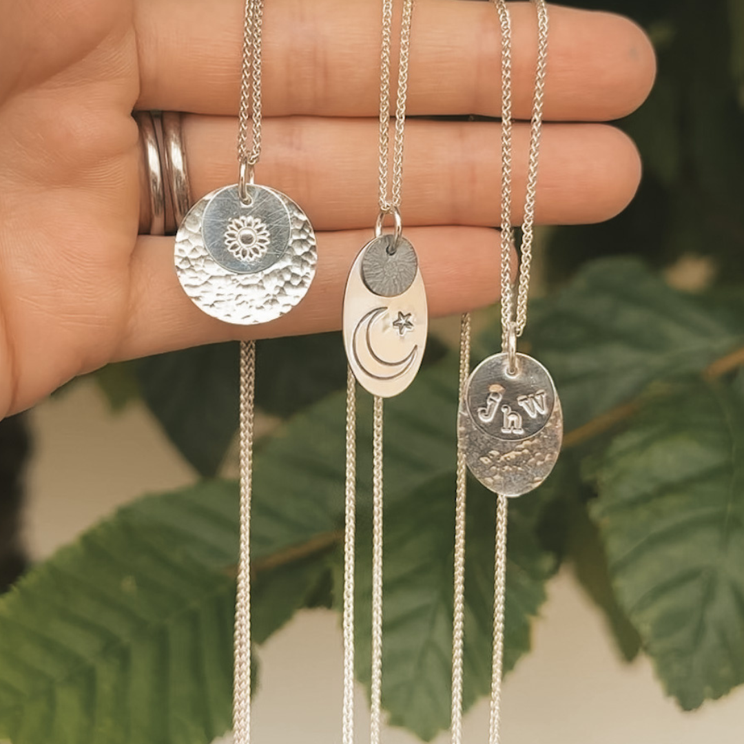 Hammered Charm Necklace Project finished pieces.png