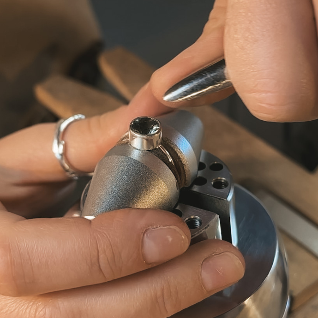 Bezel set your large round gemstone using hand tools