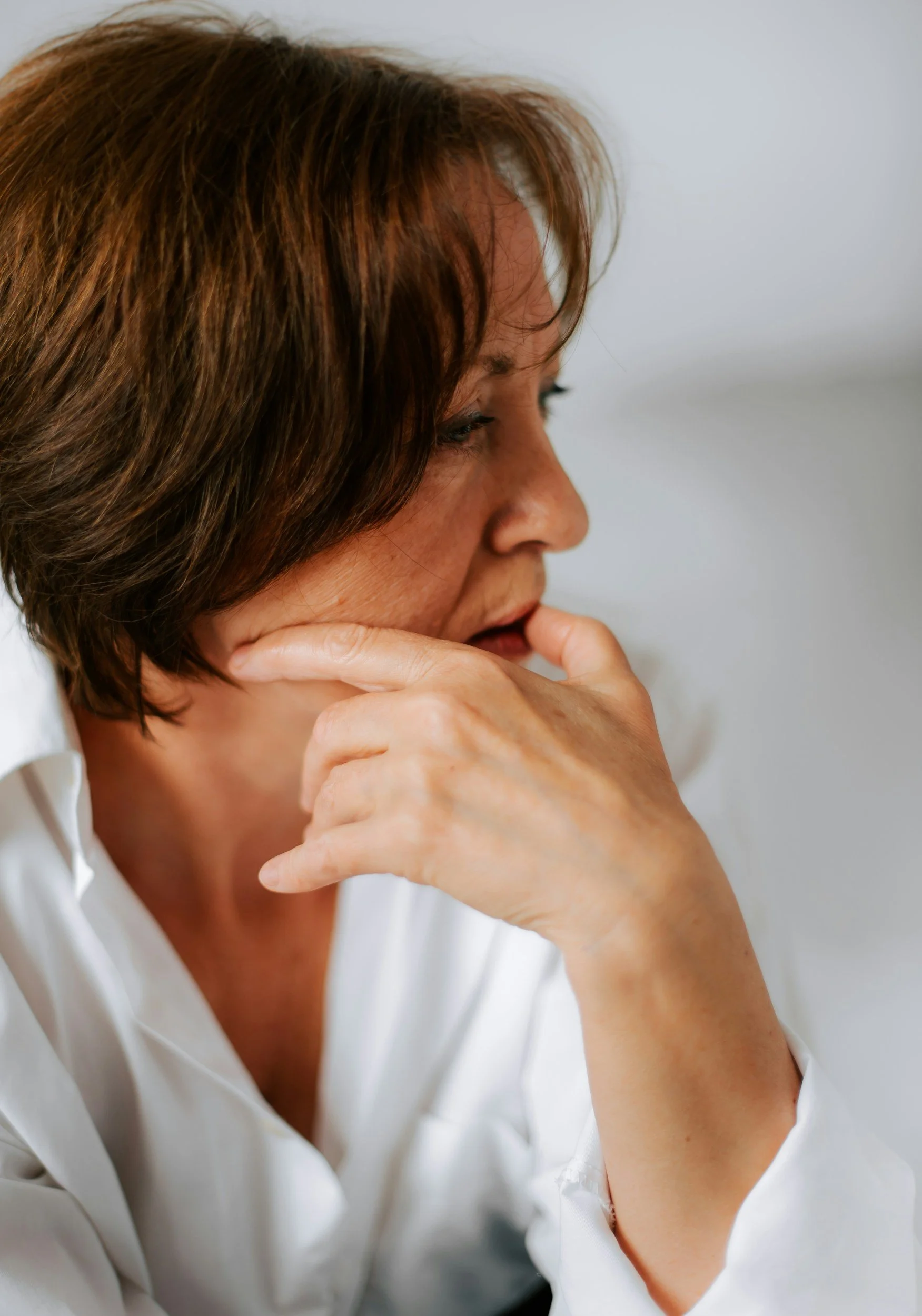 anxious woman with brown hair