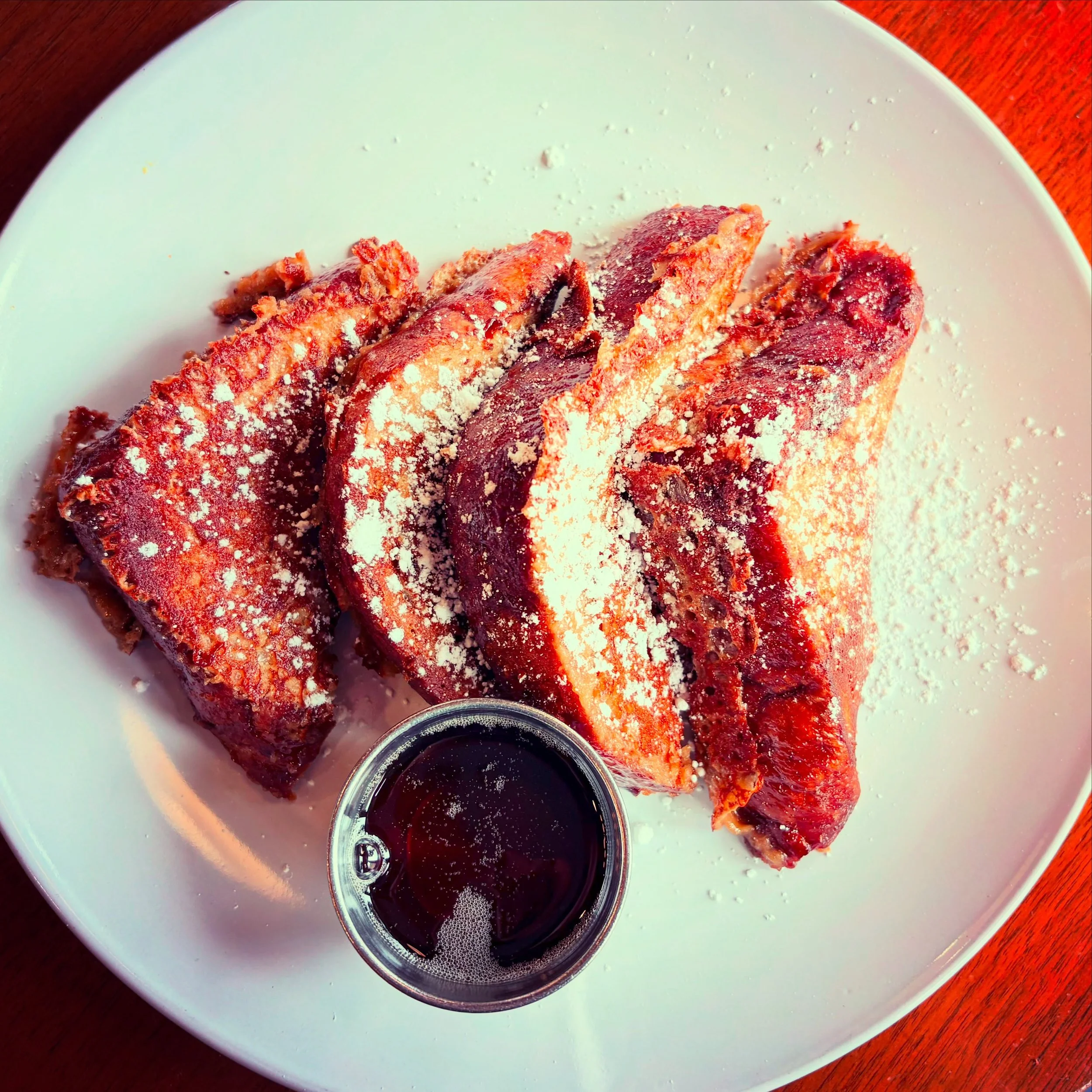 Sometimes it&rsquo;s the simple pleasures. Traditional French toast, powdered sugar and pure Michigan maple syrup. Life is good.