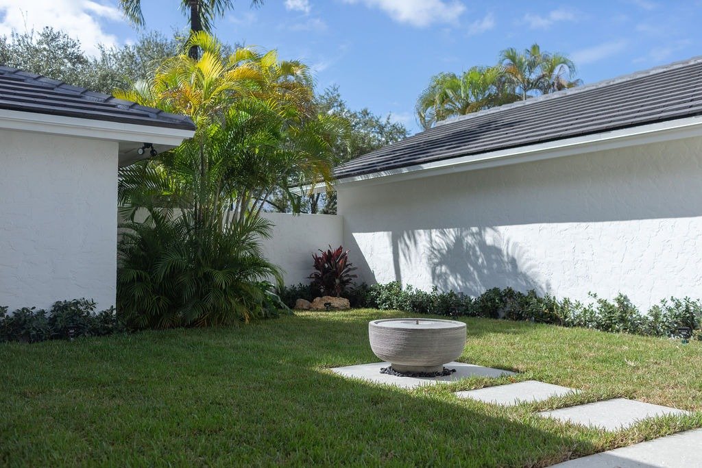 This investment property, had a unique feature with massive untapped potential. The courtyard area was overgrown and heavy with stagnant energy. With large window views from the main living areas, this space would have critical impact on how potentia