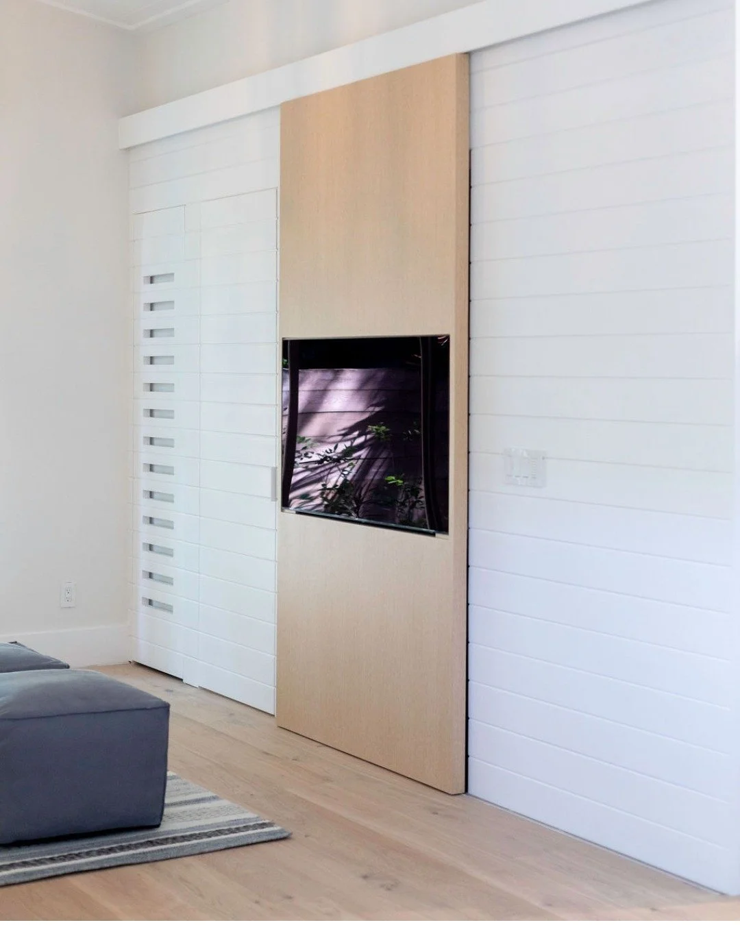 Multifaceted features that elevate the way we live in our homes is what good design is all about. ✨

This TV mounted on a sliding door, opens to reveal beautifully lit storage. Disguised as a feature wall when the door is closed, this combination of 