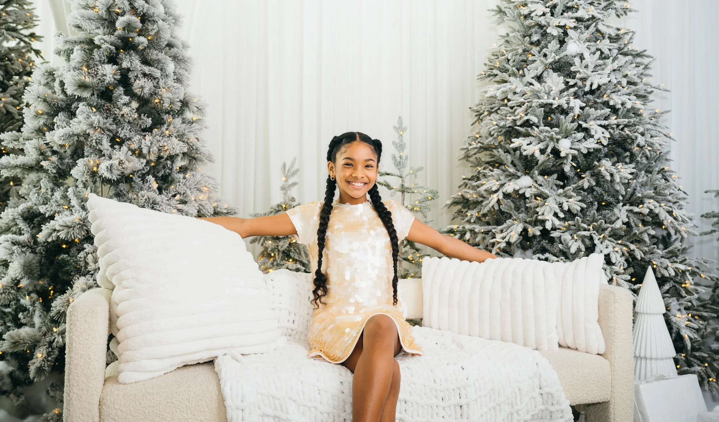 Studio family session with natural light and neutral backdrops in Miami.