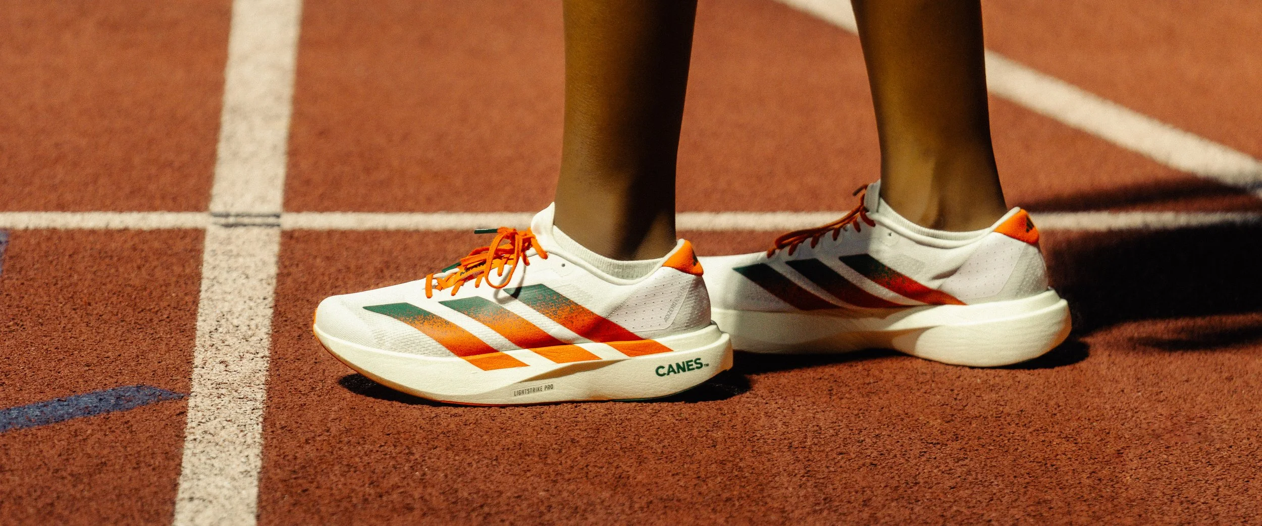 Close-up of Adidas running shoes with the University of Miami colorway, emphasizing texture, grip, and design innovation. Shot for the Adidas x UM ad spec campaign by Stephen Luttinger Photography.
