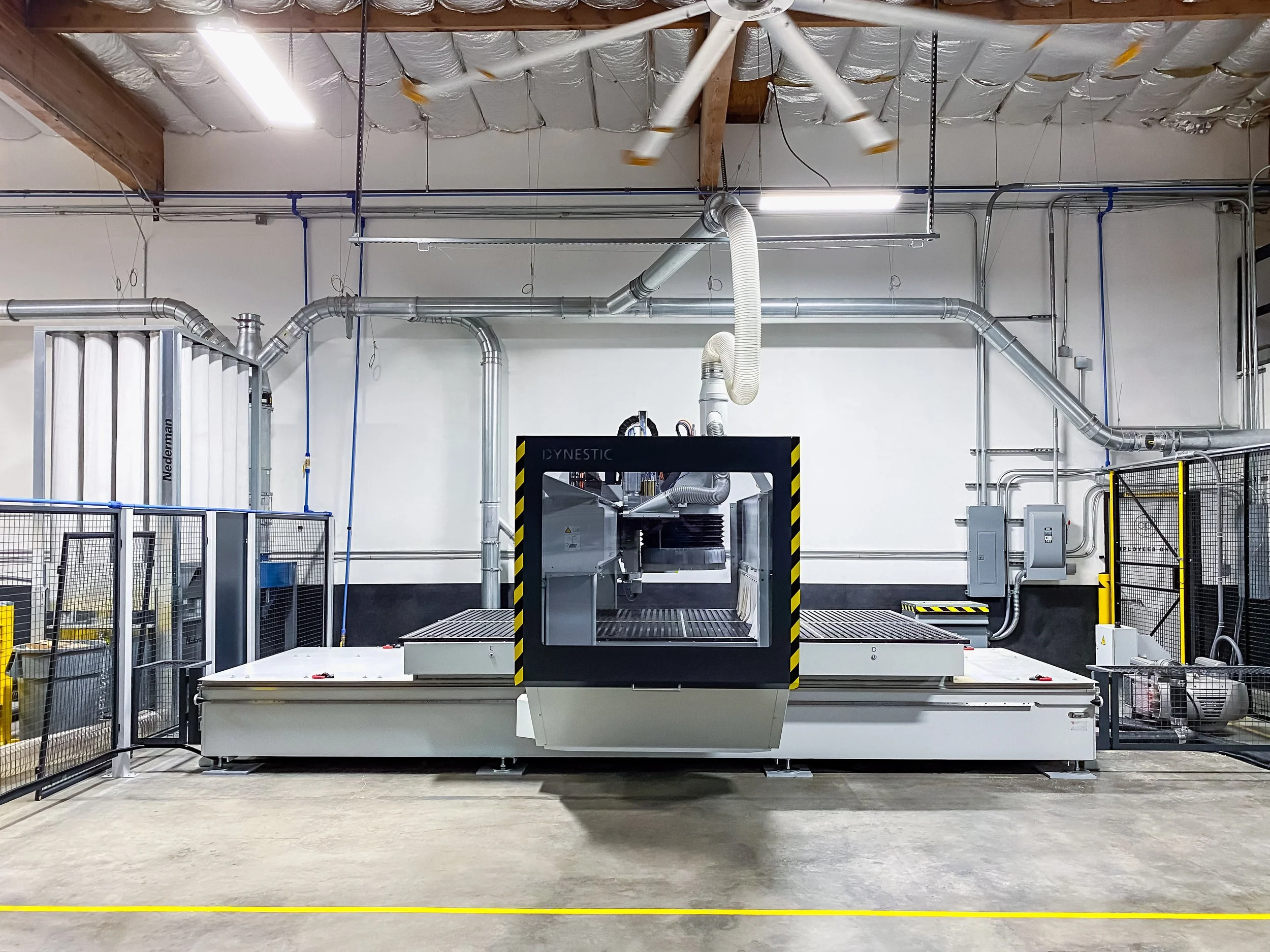 Large format, 5-axis cnc rounter able to cut sheets of plastic or wood up to over 7 feet x 12 feet.