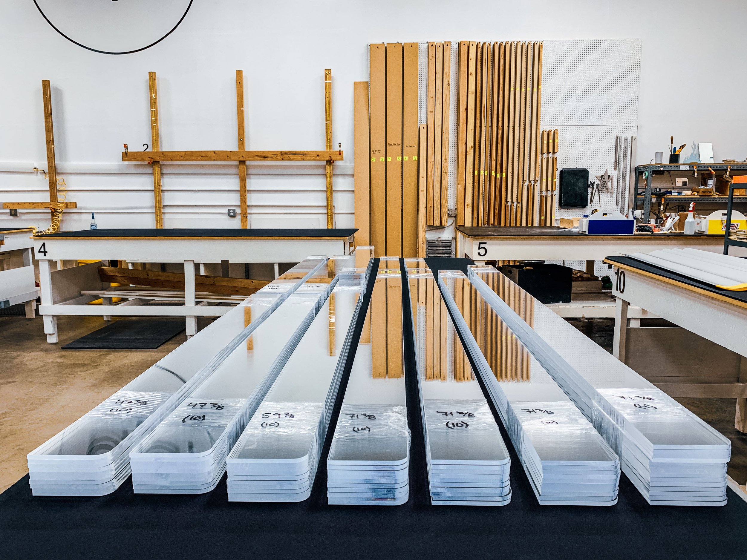 Finished cut-to-size clear acrylic panels with radius corners ready to ship.