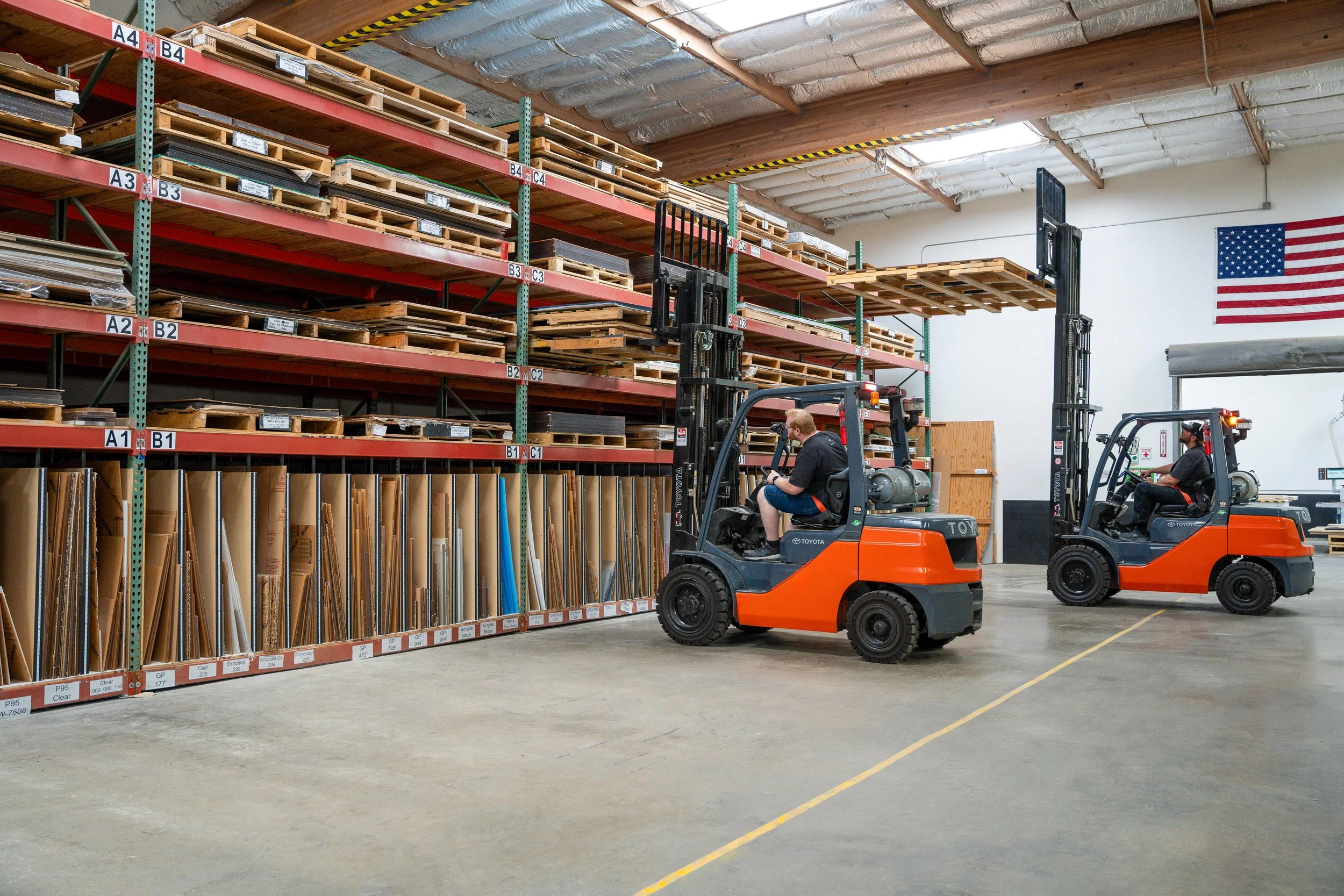Fabricators handling large in-stock acrylic sheets, including oversized panels up to 88 by 150 inches, for CNC machining at Architectural Plastics.