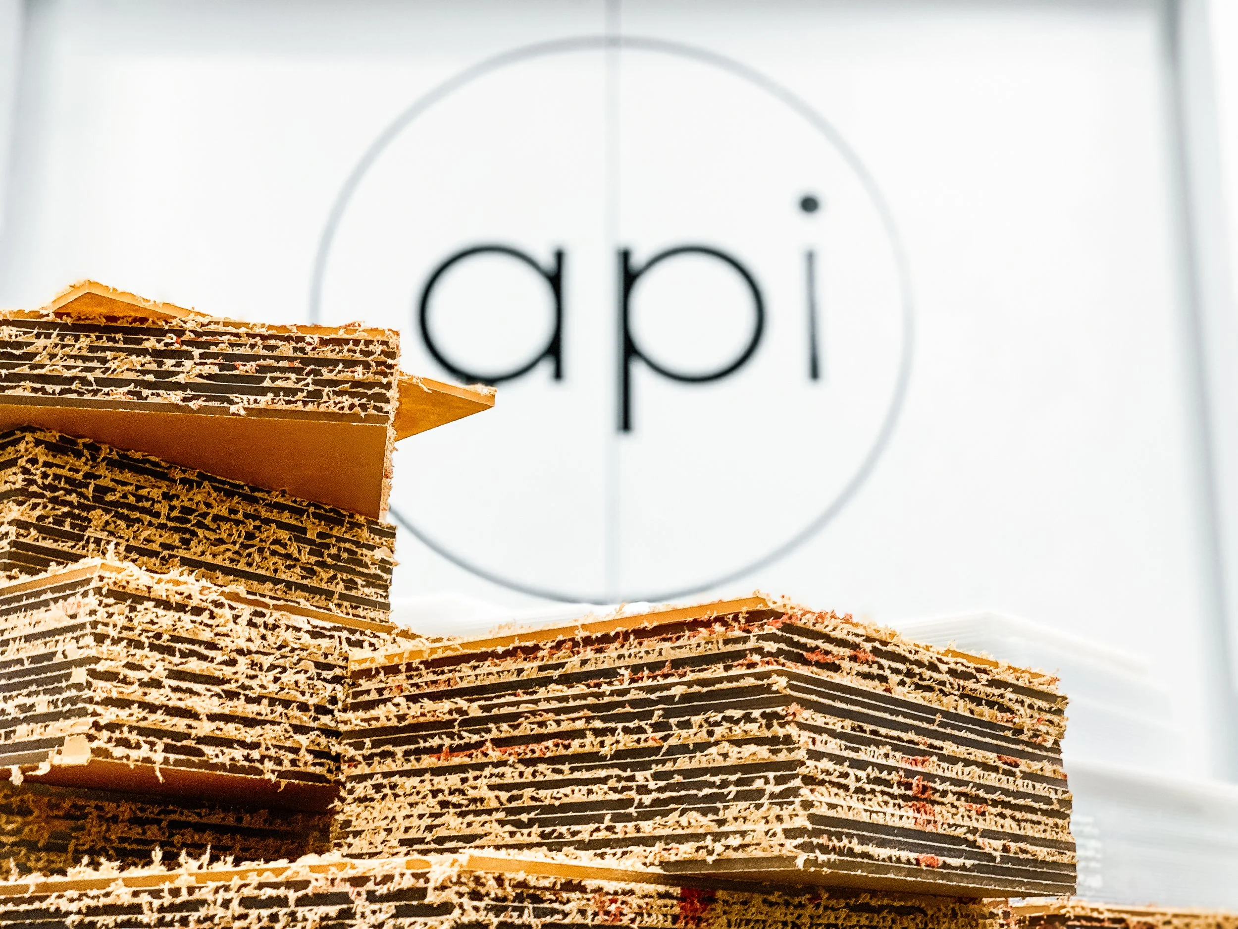 Clear acrylic, cut-to-size panels stacked and ready for production.