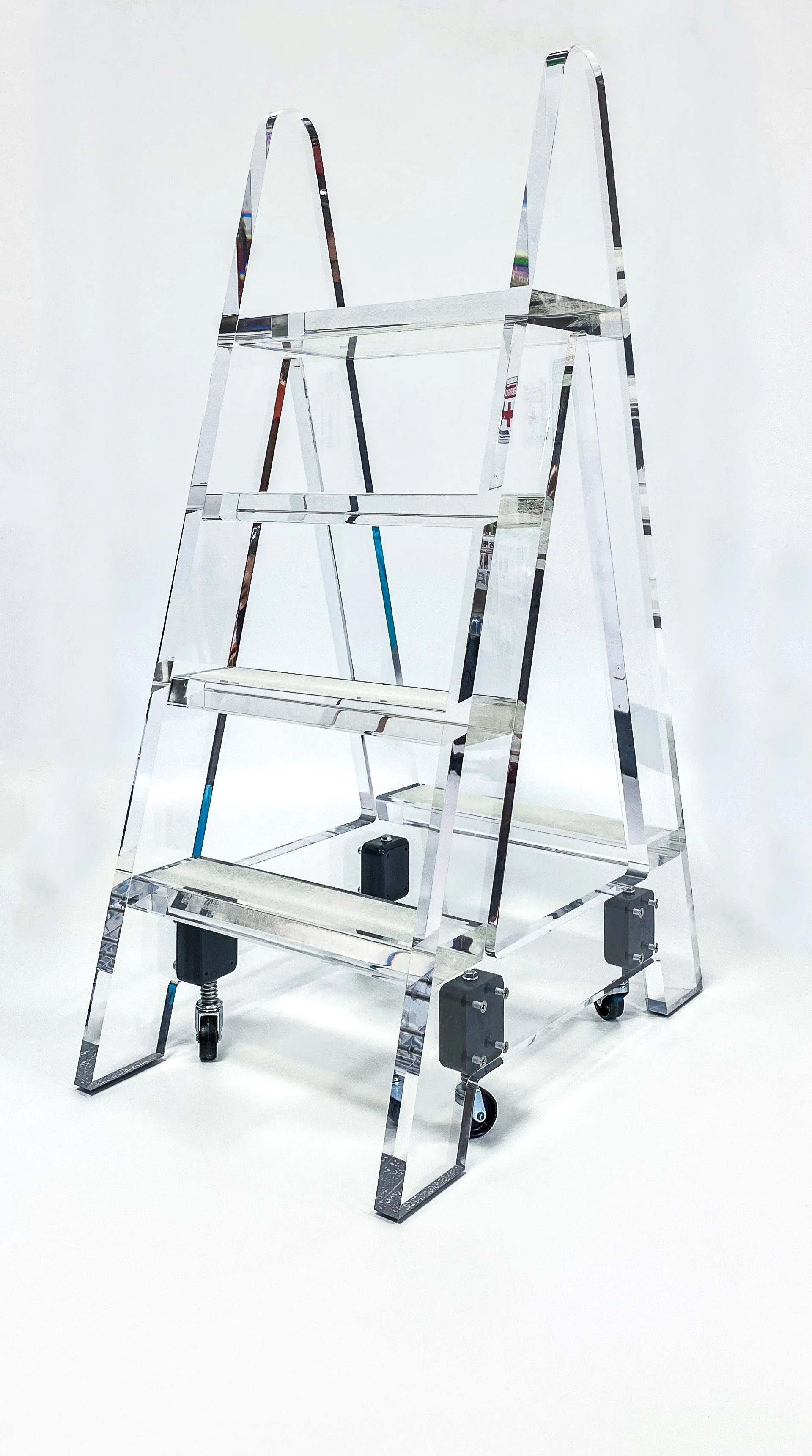 Architectural Plastics, Inc. clear acrylic step ladder featuring numerous crystal clear glue seams.