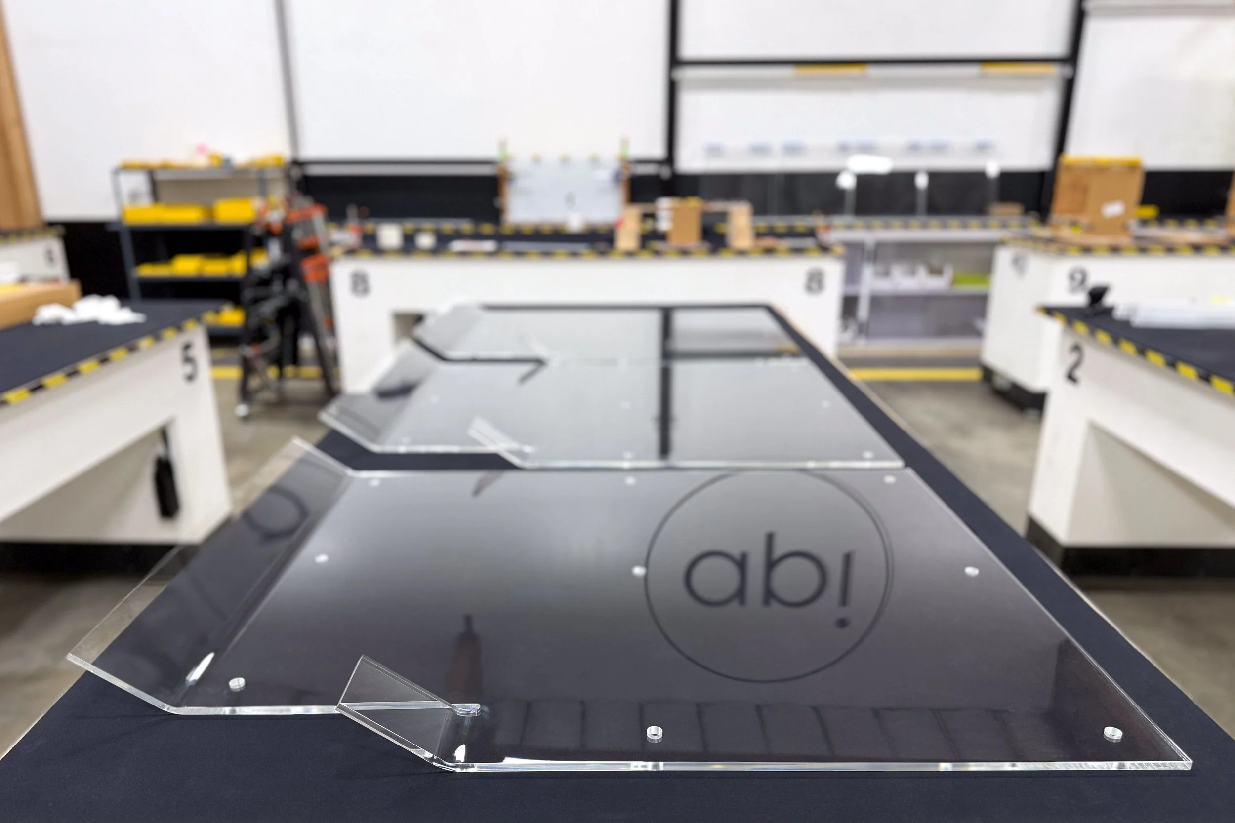 Clear acrylic panels with bent sections done by line heating and bending methods.  Holes drilled for attachment to a structure.