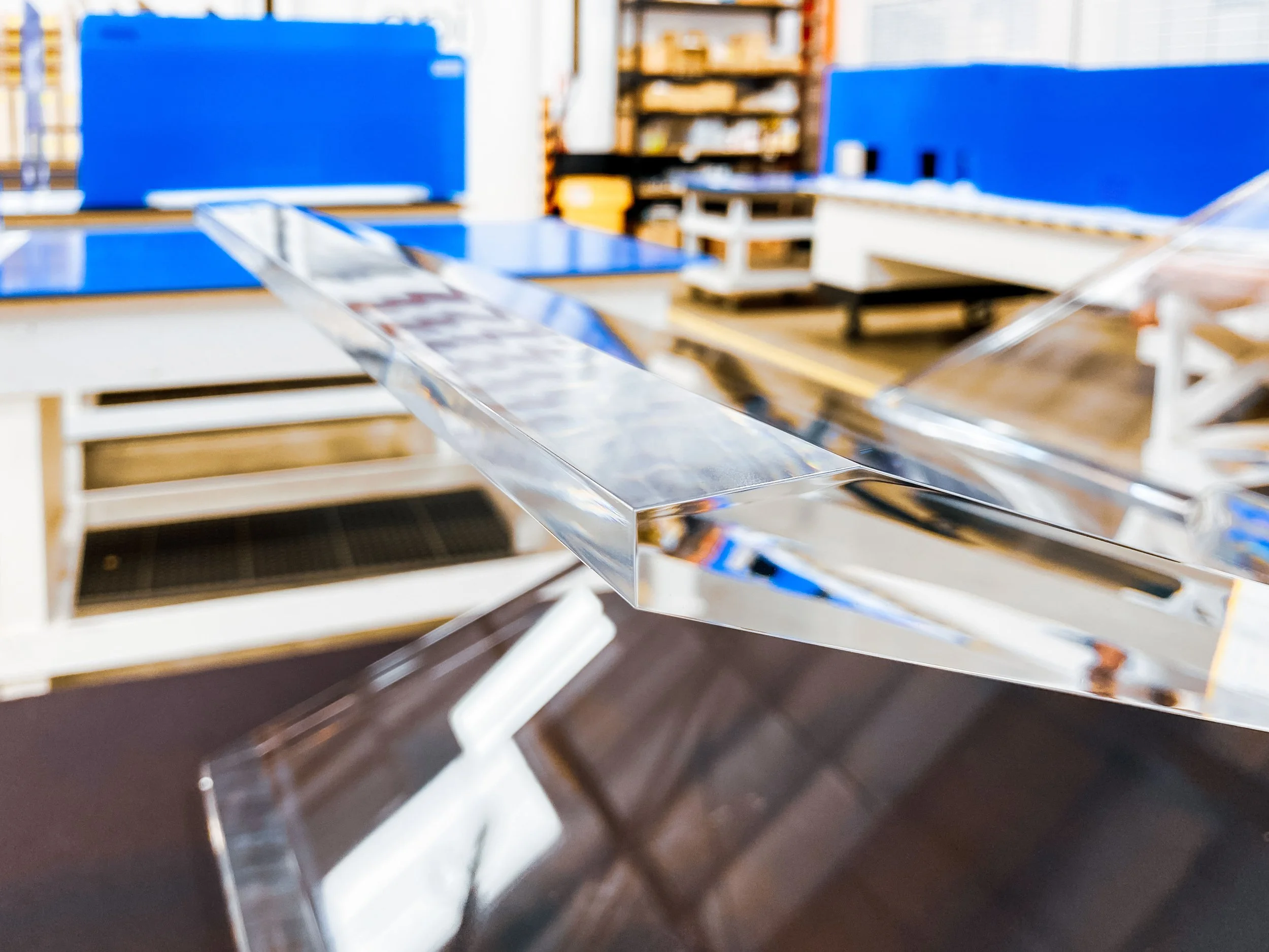 Clear acrylic "X" assembly with buff polished edges and facets.