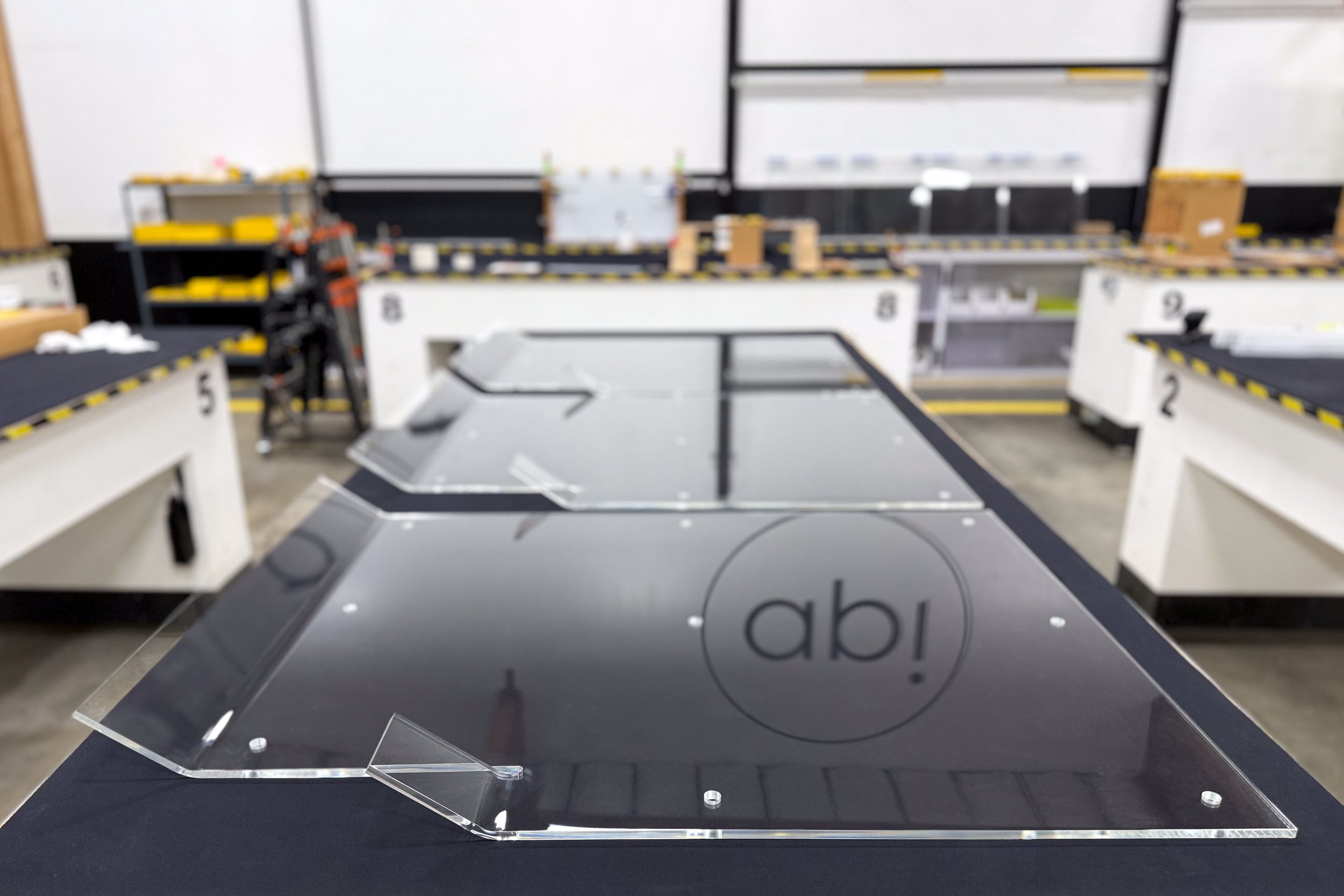 Thermoformed acrylic panel cover with formed bends and trimmed edges, prepared for installation as a protective cover.