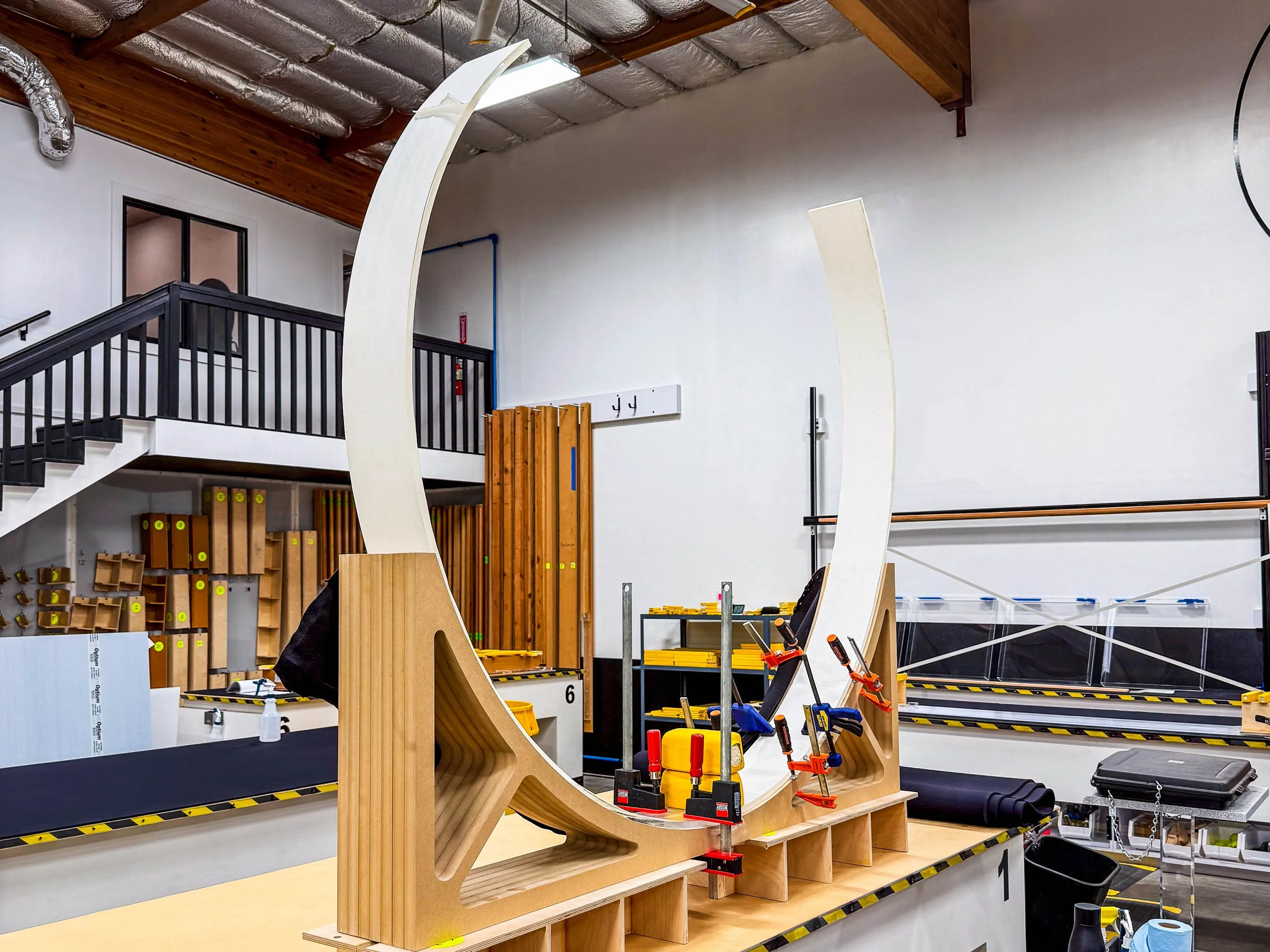 Thermoforming mold and fixture setup used to control curvature and hold alignment during cooling.