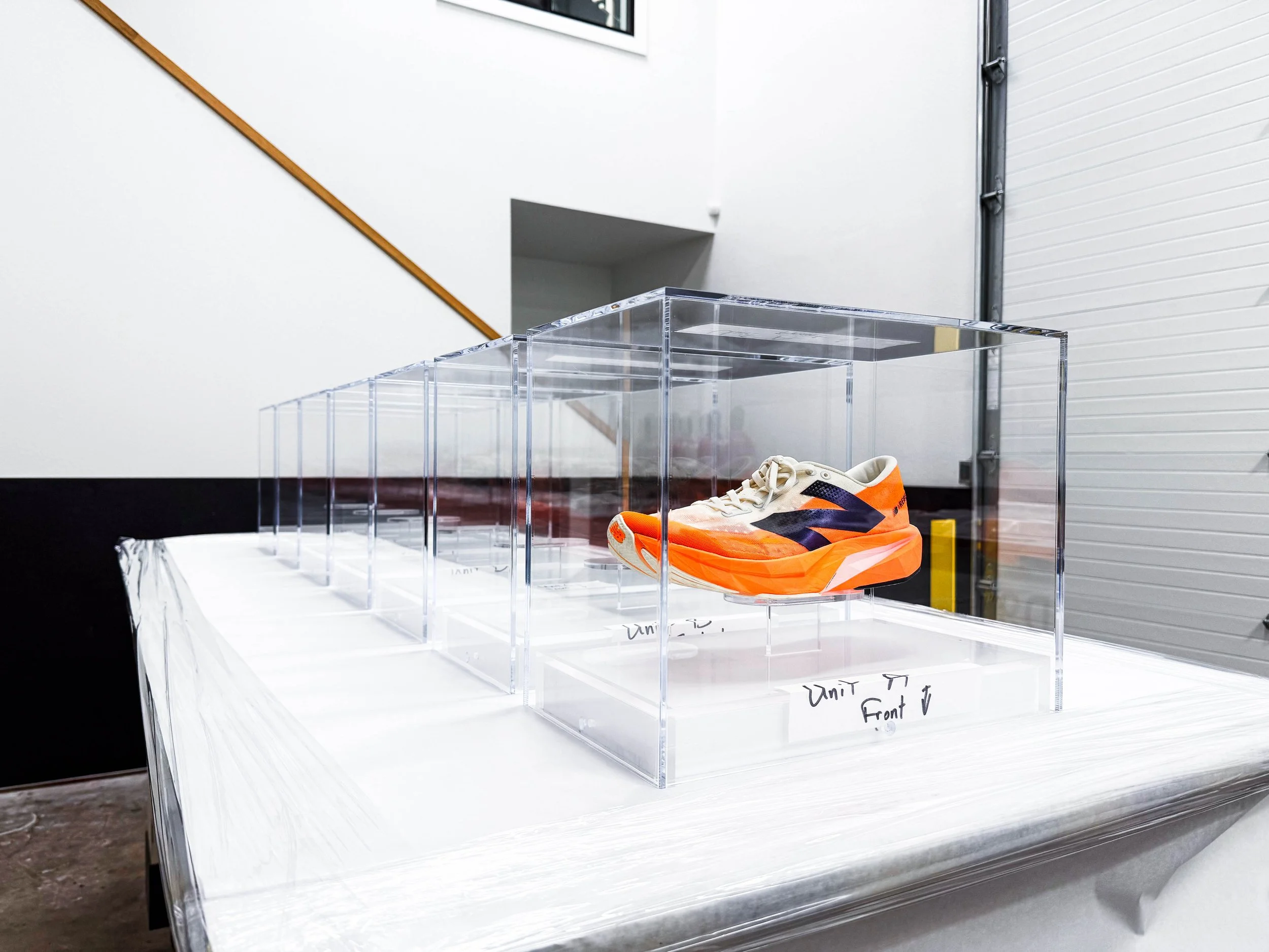 Bonded acrylic display cases used in a high-visibility retail installation, requiring clean seams and optical clarity.