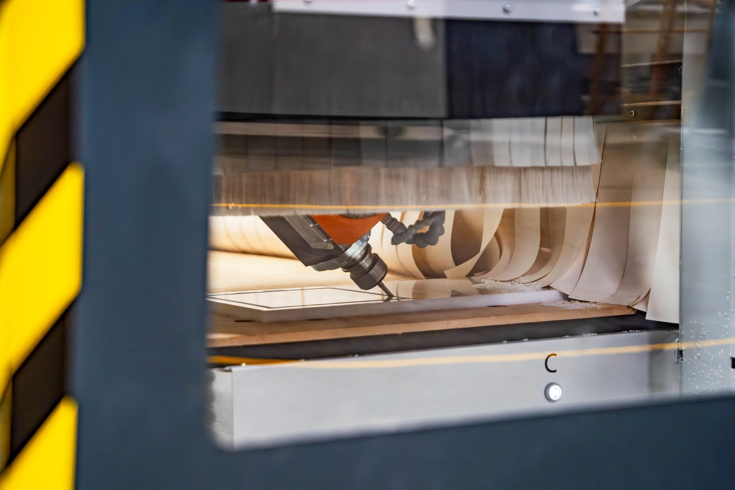5-axis CNC milling at an angle, enabling complex profiles and features not possible on 3-axis machines.