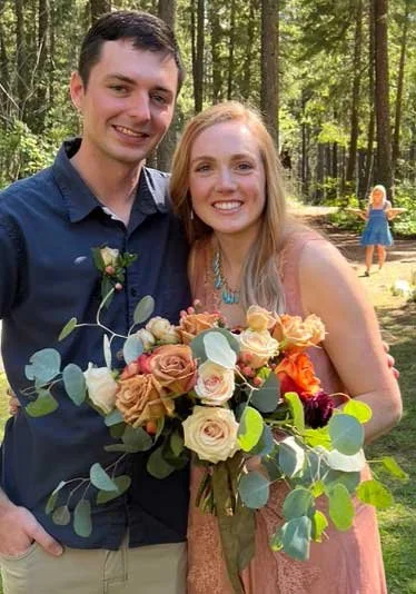 bride and groom with flowers