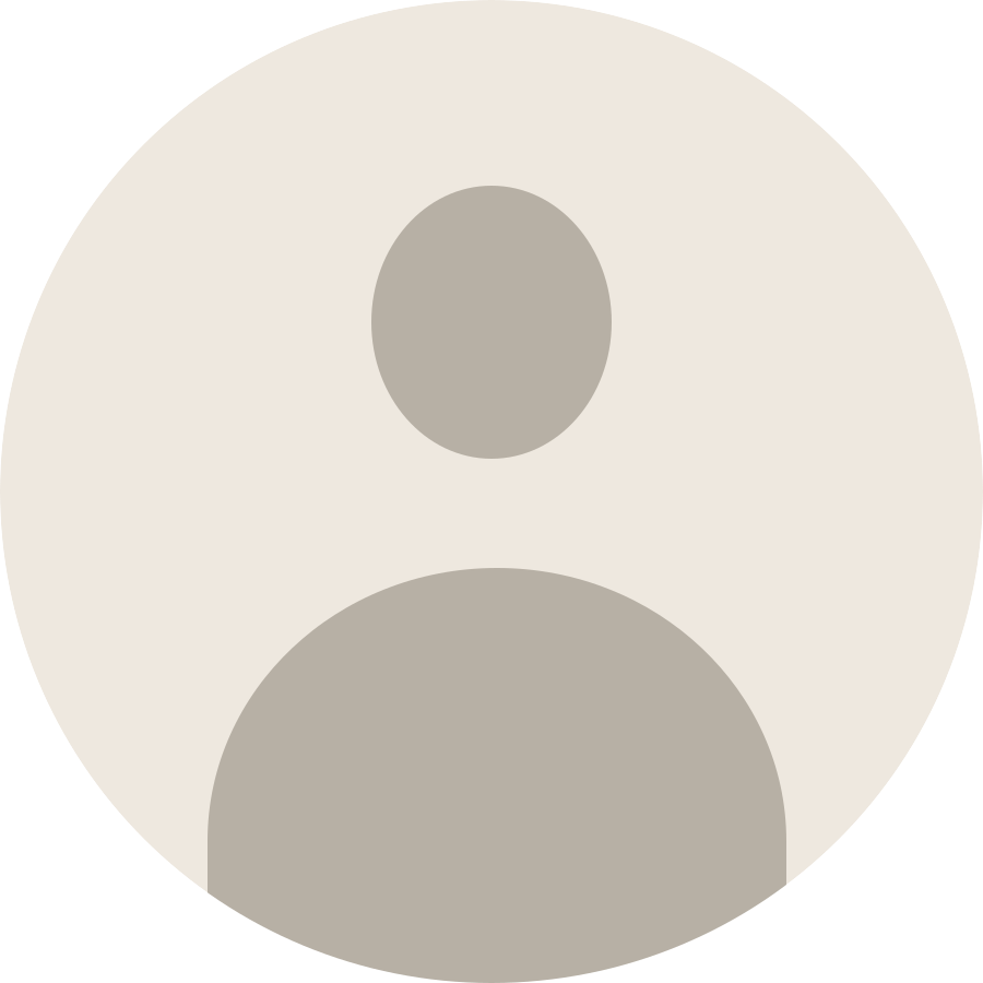 A simplified silhouette of a person with a circular head and rounded shoulders, depicted in shades of gray.