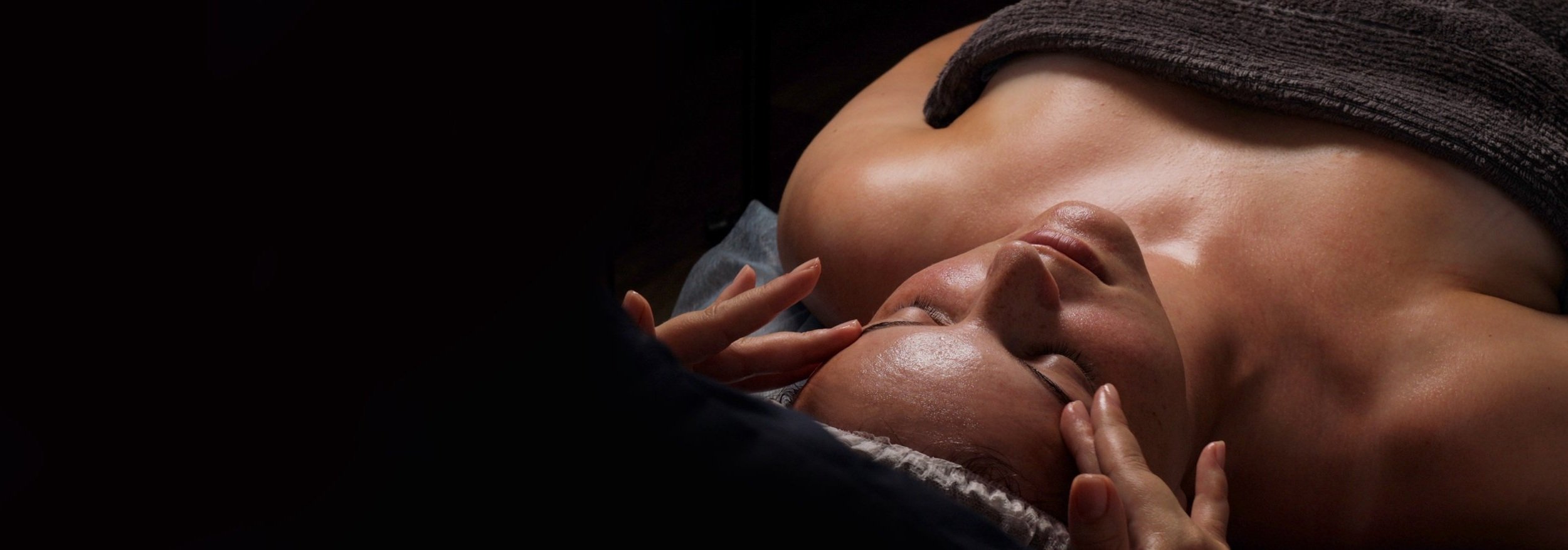 a woman receives a facial
