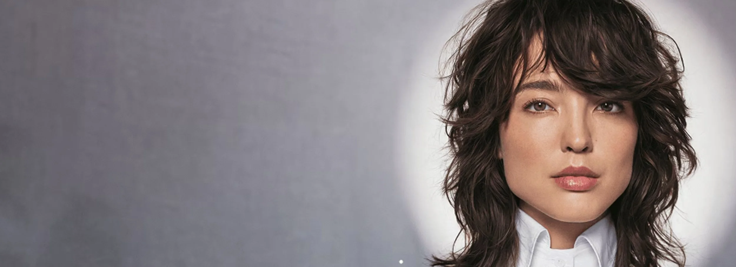 a woman with tousled hair