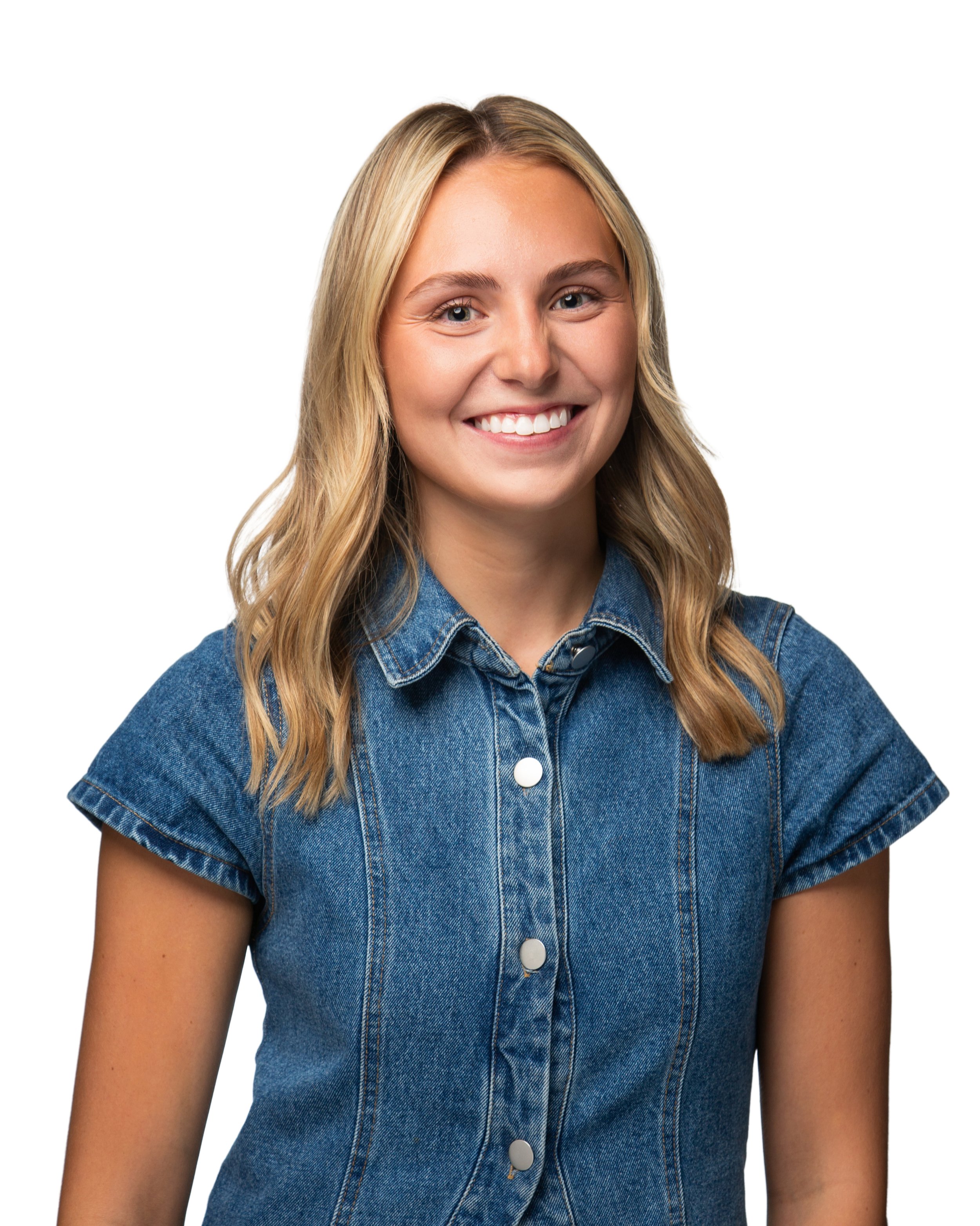 Close-up of a smiling woman with long blonde hair wearing a denim jacket, isolated on a white background.