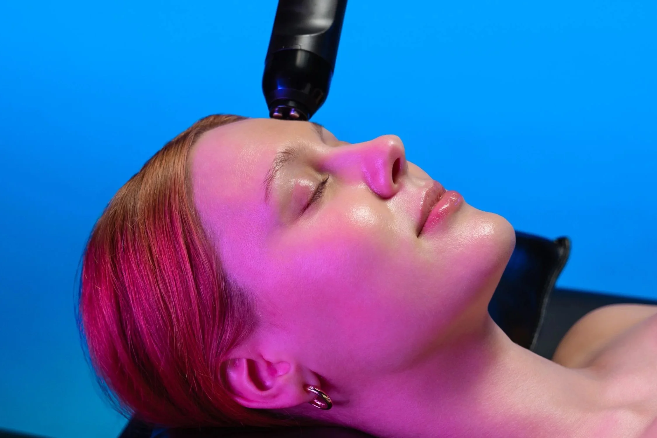 a woman receives a glo2 rf custom facial