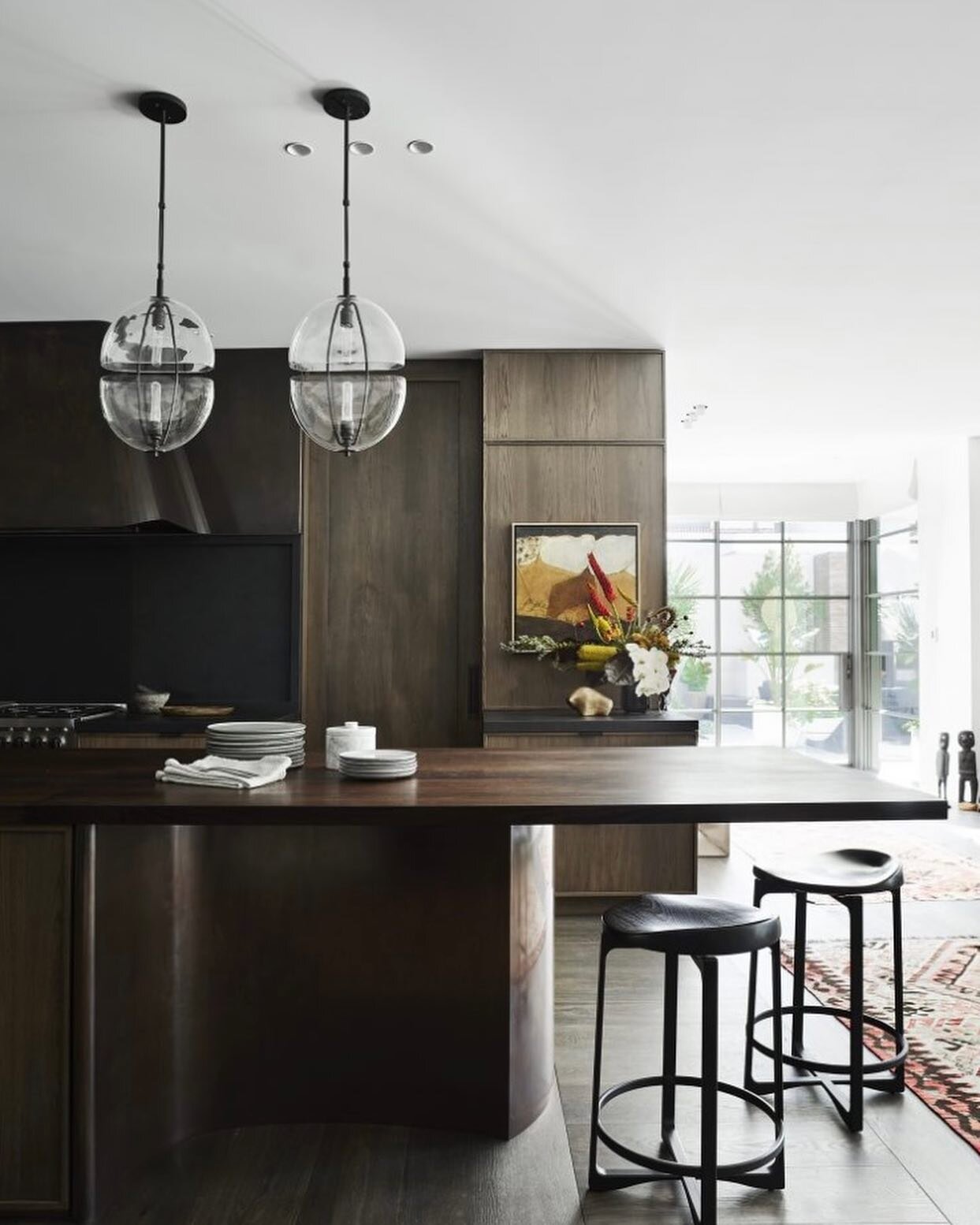 Contemporary meets authentic classic. 

These deep browns, textured blacks,
offset by natural light and sculptural details create the ultimate statement home that never goes out of style. 

What&rsquo;s your favourite element. 

Design @decus_interio