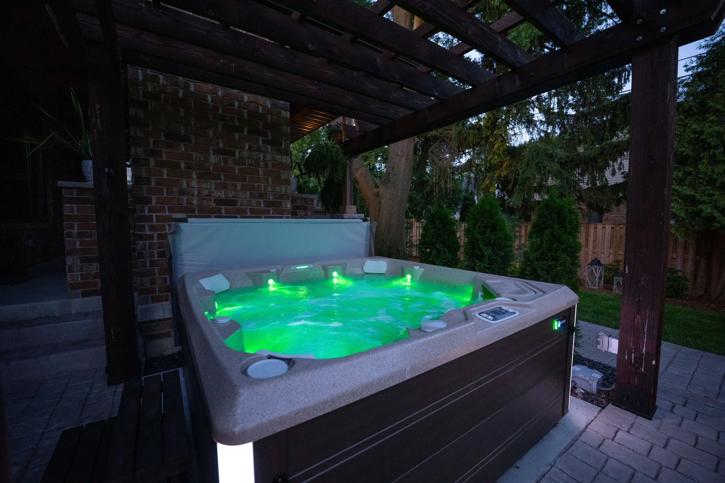 windsor_landscaper_hot tub with concrete steps and landscaping.jpg