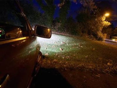 Honolulu ghost tour, the urban legend of Morgan's Corner shows a car parked on a dark road in the woods