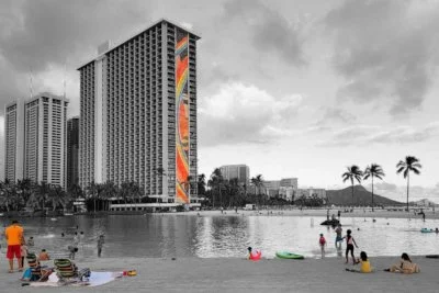 Black and white with spot color image of haunted Hilton Hawaiian Village