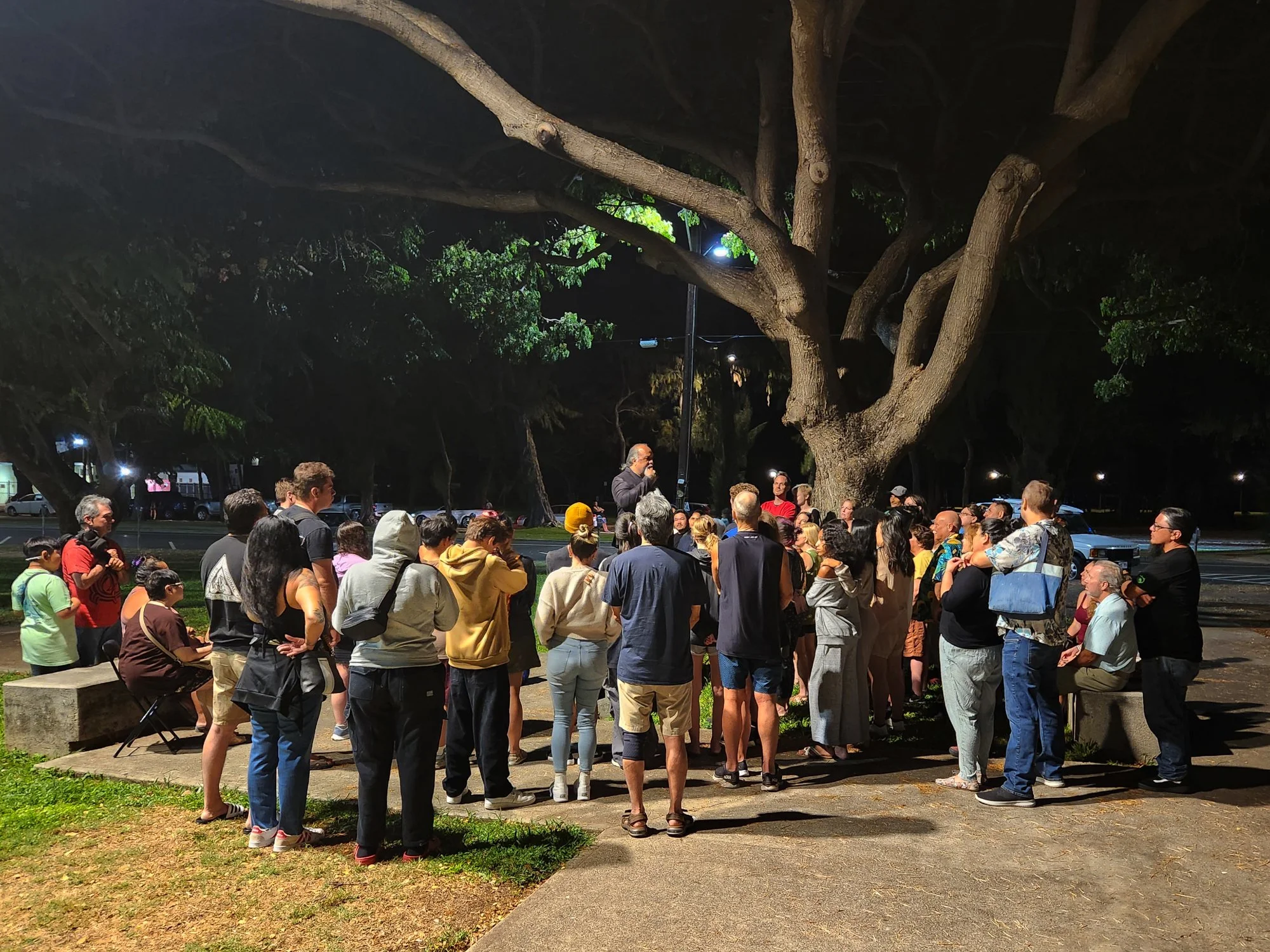 Honolulu ghost tour Waikiki night marchers large crowd gathered Hawaii ghost stories