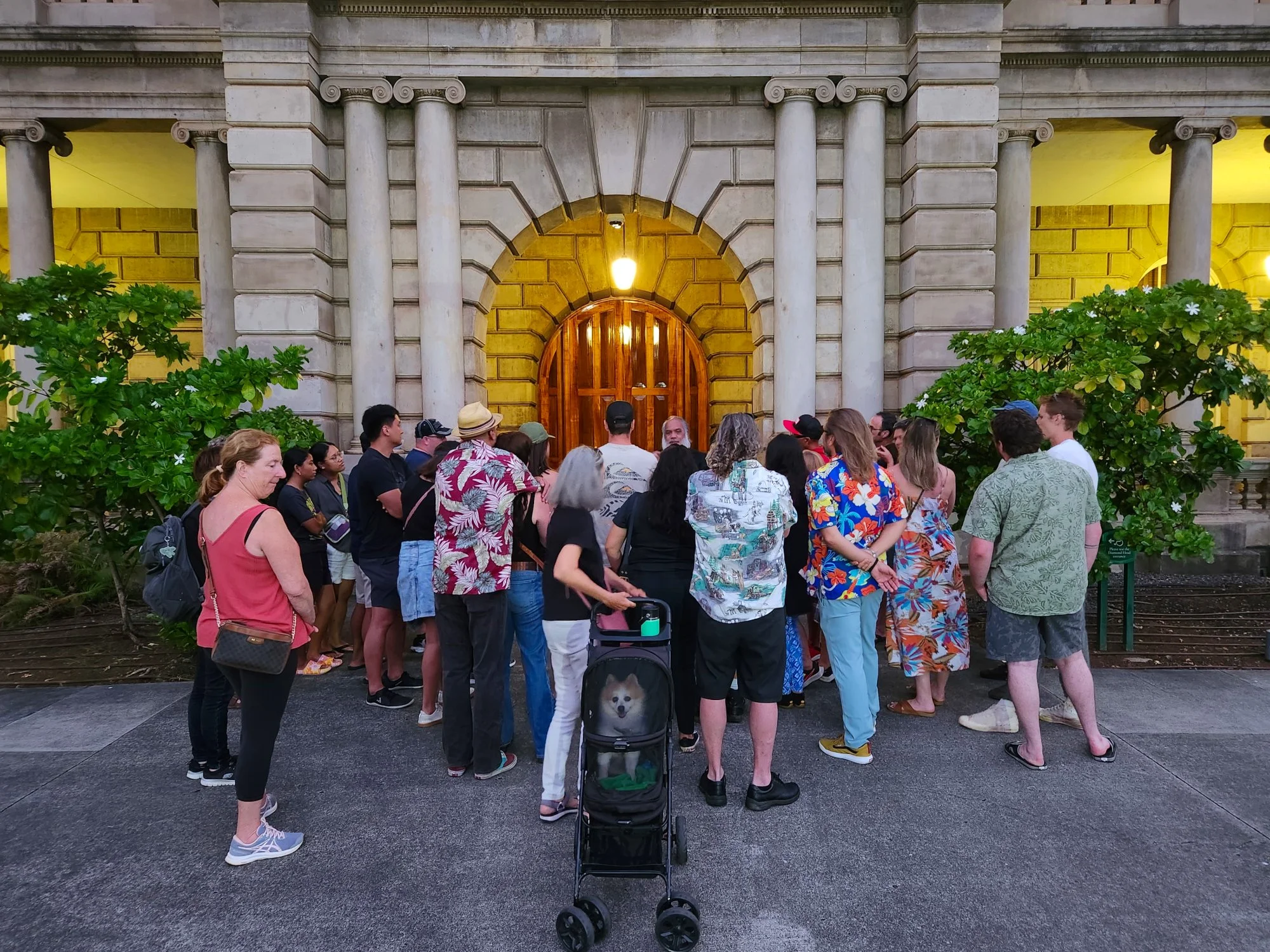 Honolulu ghost tour gathered in front of haunted Aliiolani Hale listening to Hawaiian ghost stories