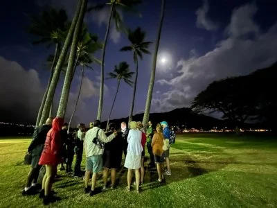A crowd learns about night marchers on our haunted Honolulu ghost tour