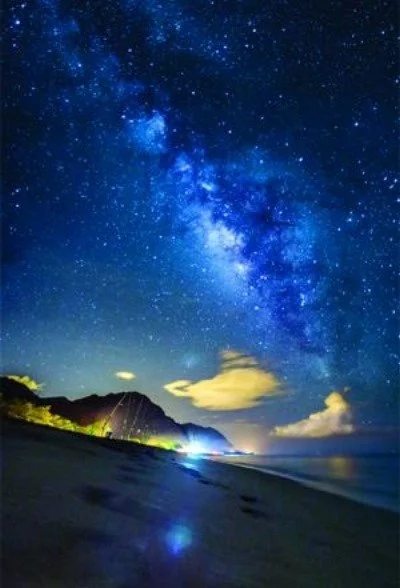 Milky Way shines over Keawaula Beach at night in Haunted Hawaii