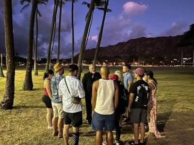 Waikiki Night Marchers Ghost Tour under a purple sky at Kapiolani Park & Diamond Head, Waikiki, Honolulu