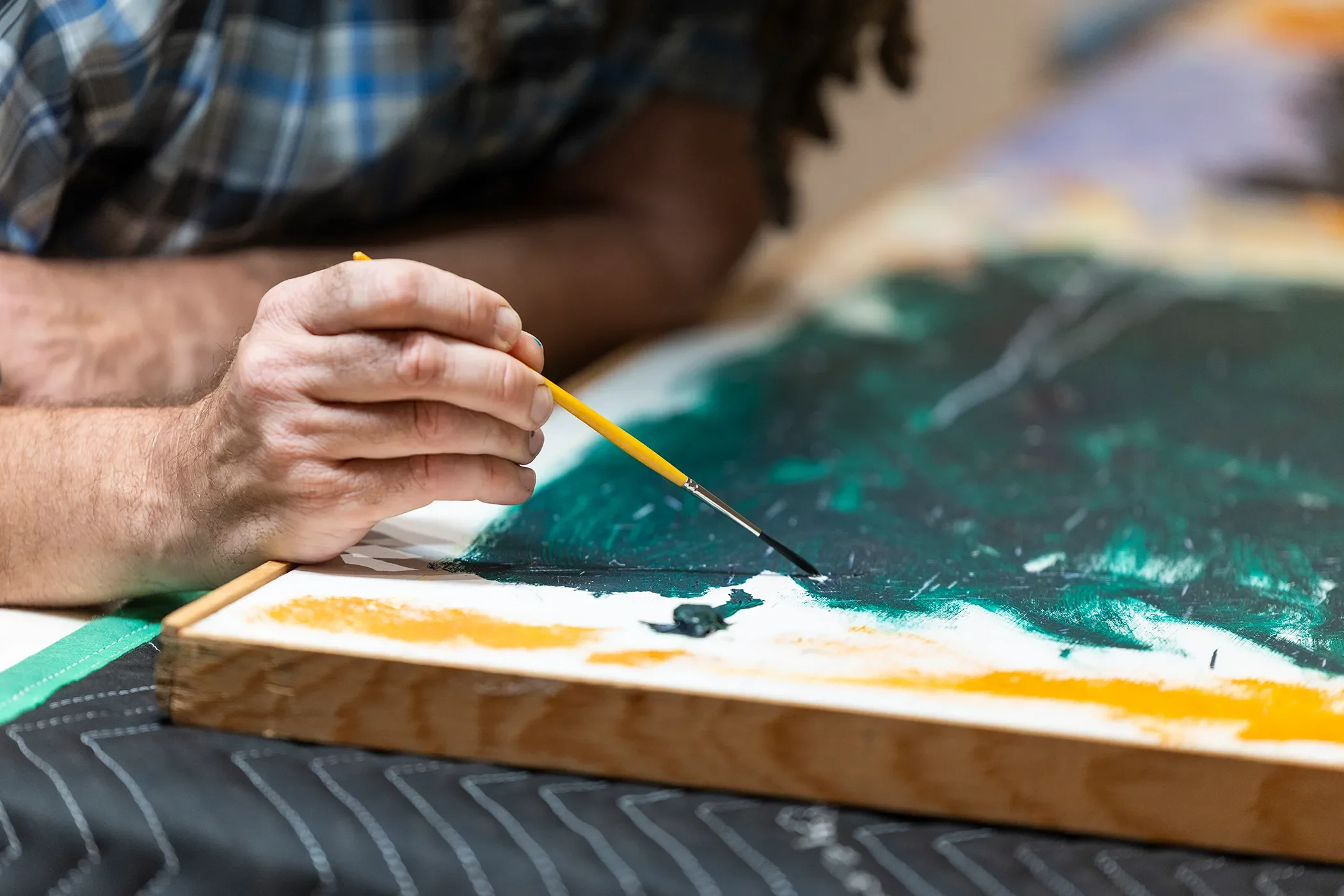 Detail view of restoration work on canvas.