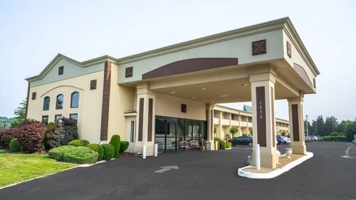 Exterior view of a hotel building with an entrance canopy