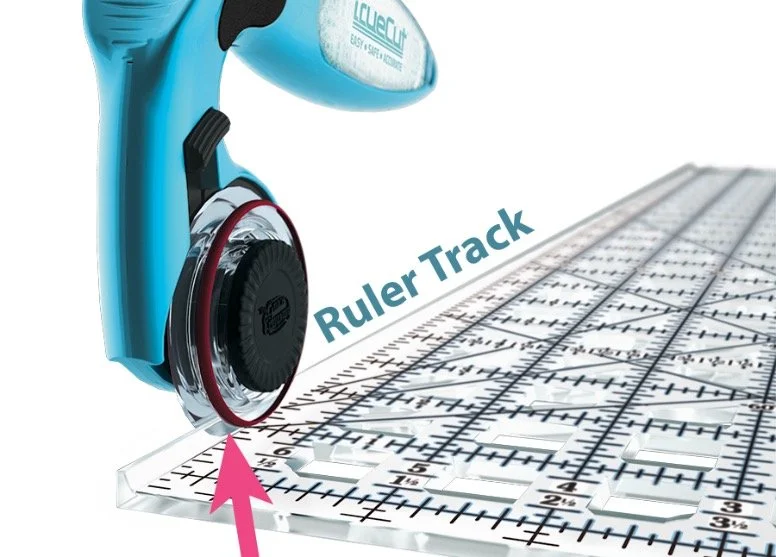 I love the track system on the TruCut rulers and rotary cutters.  The rulers are light weight, easy to handle, and the track system keeps your fingers safe!