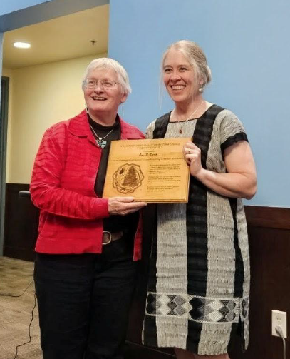 Anne Lynch receiving Founders Award from Brytten Steed
