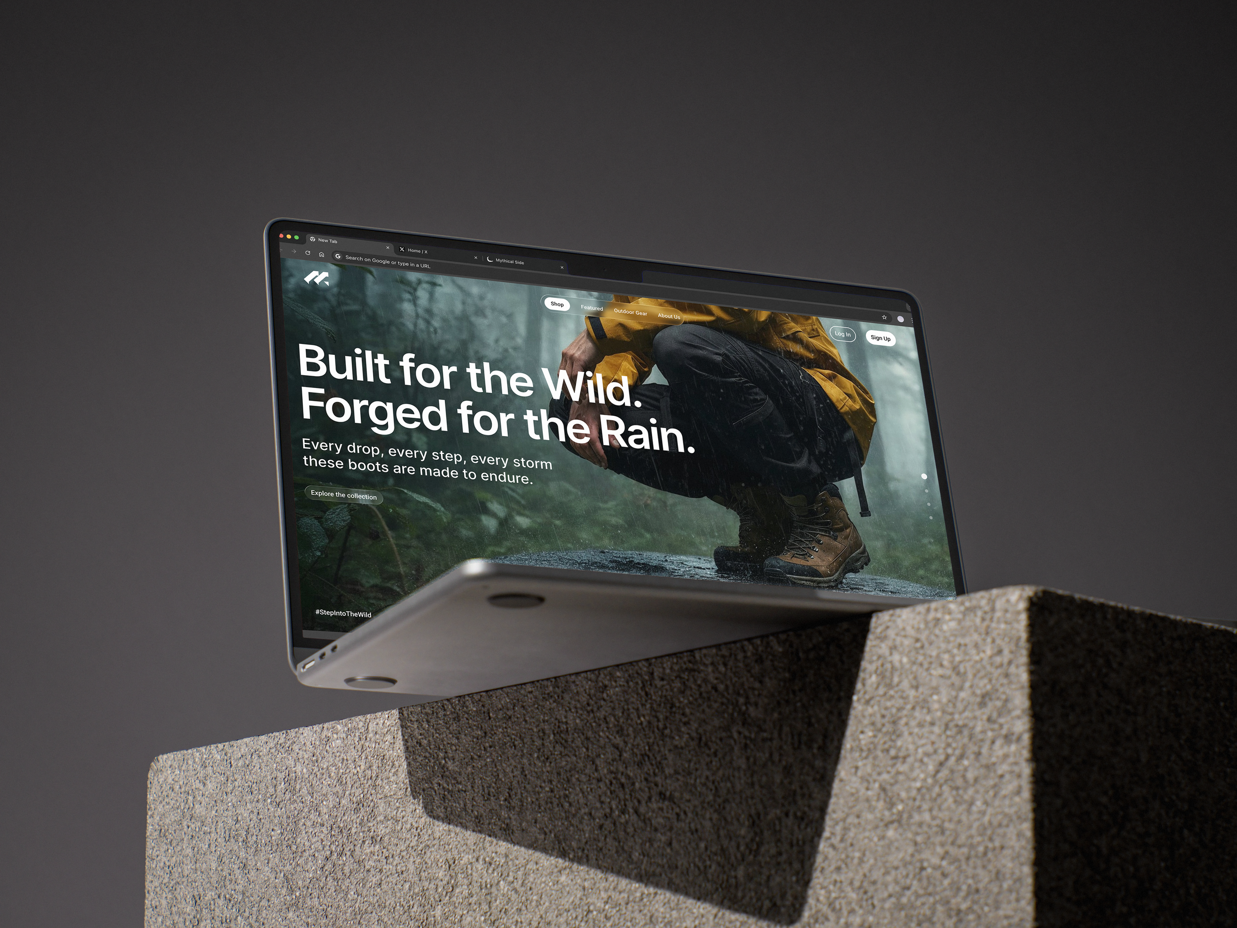 Close-up of a digital tablet displaying outdoor gear website with a person in rain gear, squatting in a rain-soaked forest environment, on a stone pedestal against a gray background.
