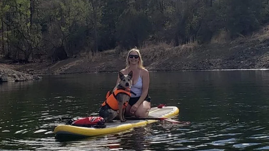 Sitting paddleboarding with Gunner.jpg