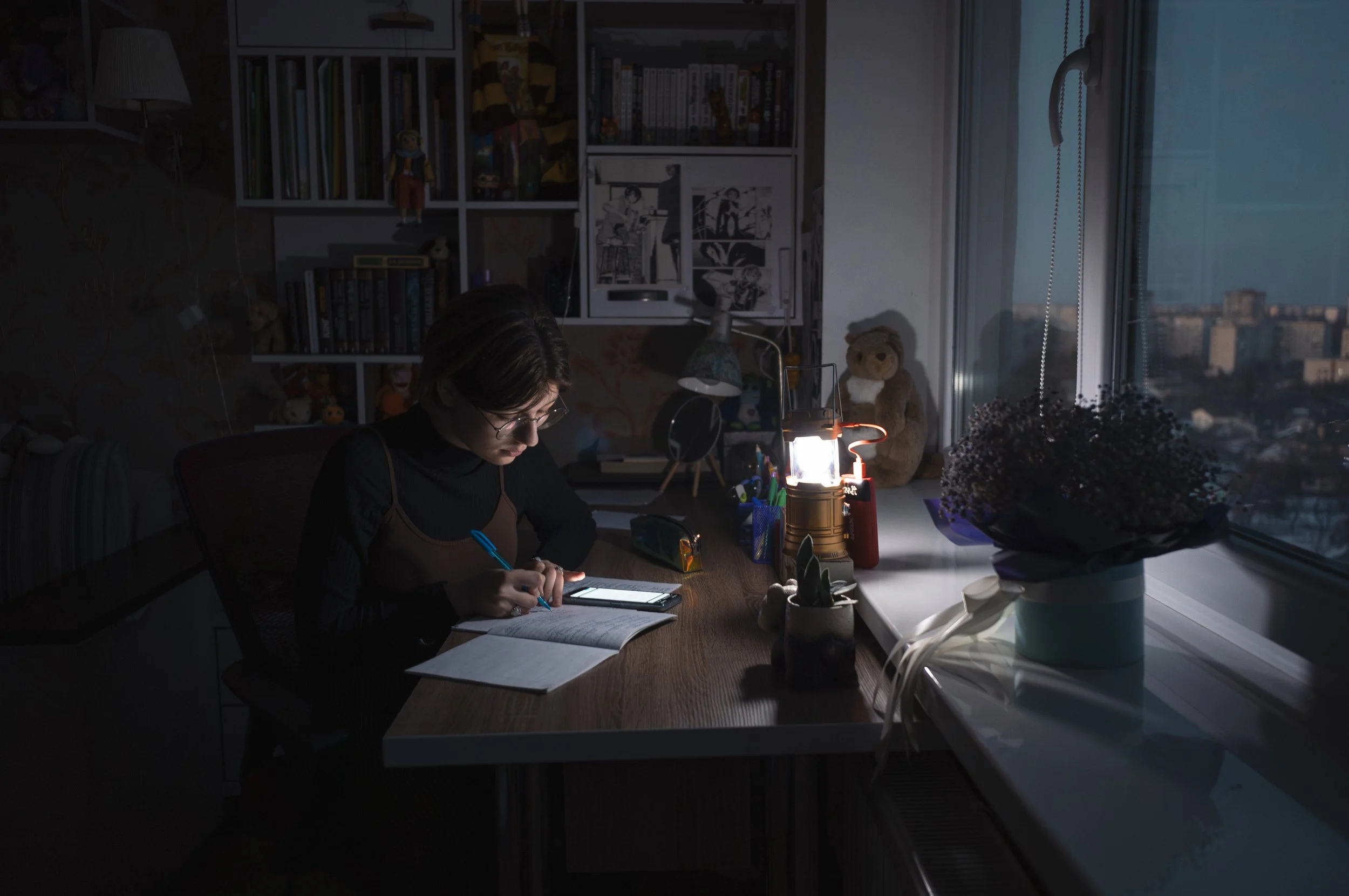 Fifteen-year-old Karina Bykova, residing in a high-rise in Chernihiv, Northern Ukraine, faces daily power outages, leading to darkness and cold at home, with the water supply often cut off.  ‘After school, I have about three hours to do my homework b