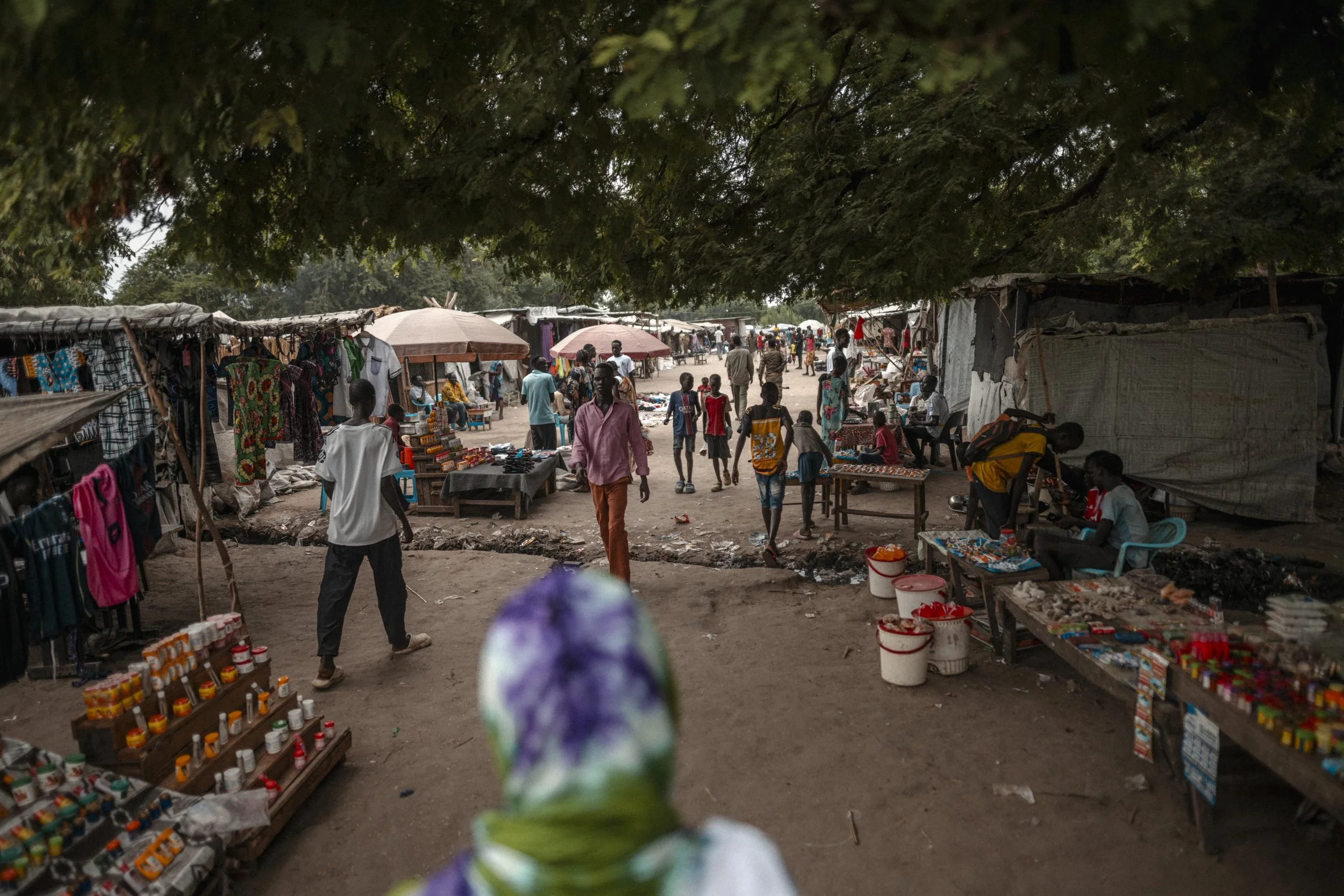 Paguir market occupies some of the area’s surviving high ground. The settlement has grown as flooding and conflict displaced families from surrounding communities.