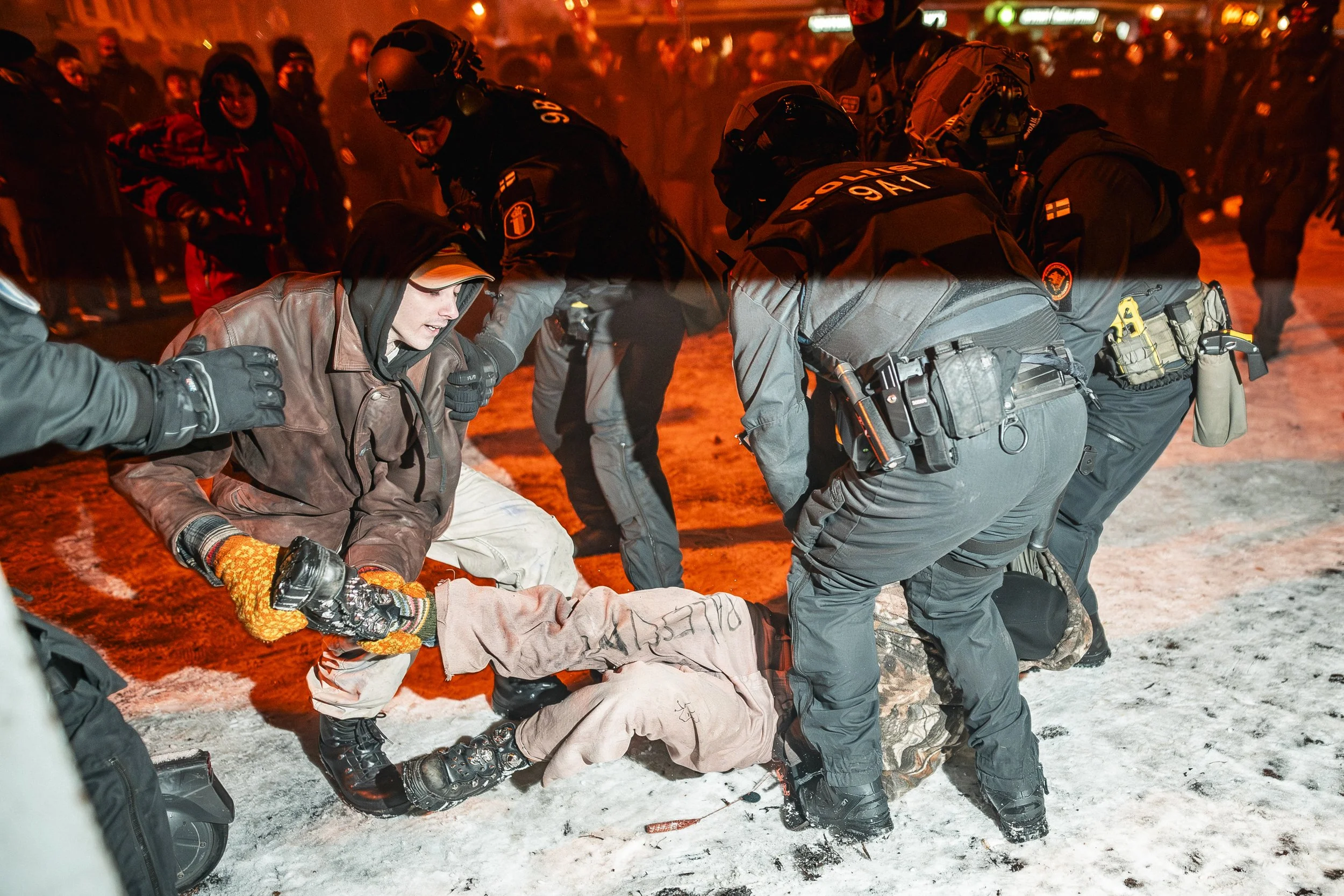 Police detain a protester at Töölöntori in Helsinki during demonstrations opposing the far-right 612 torch procession on Finland’s Independence Day in 2024. The event later prompted allegations of excessive force against protesters and interference w