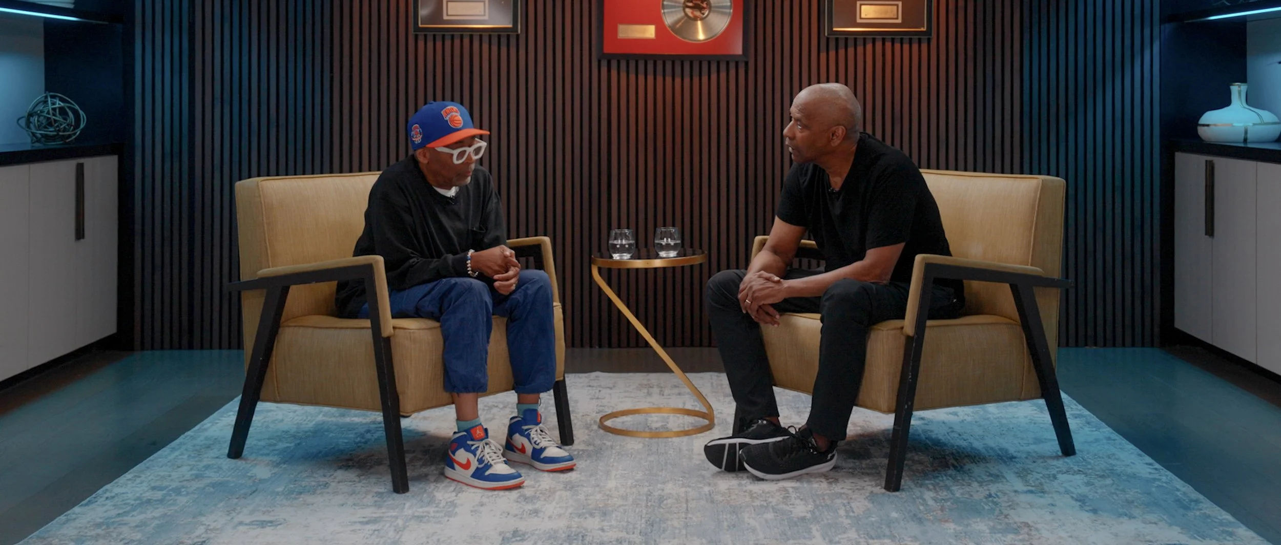 Apple TV Highest 2 Lowest promo image with cast Denzel Washington and Spike Lee in dynamic pose