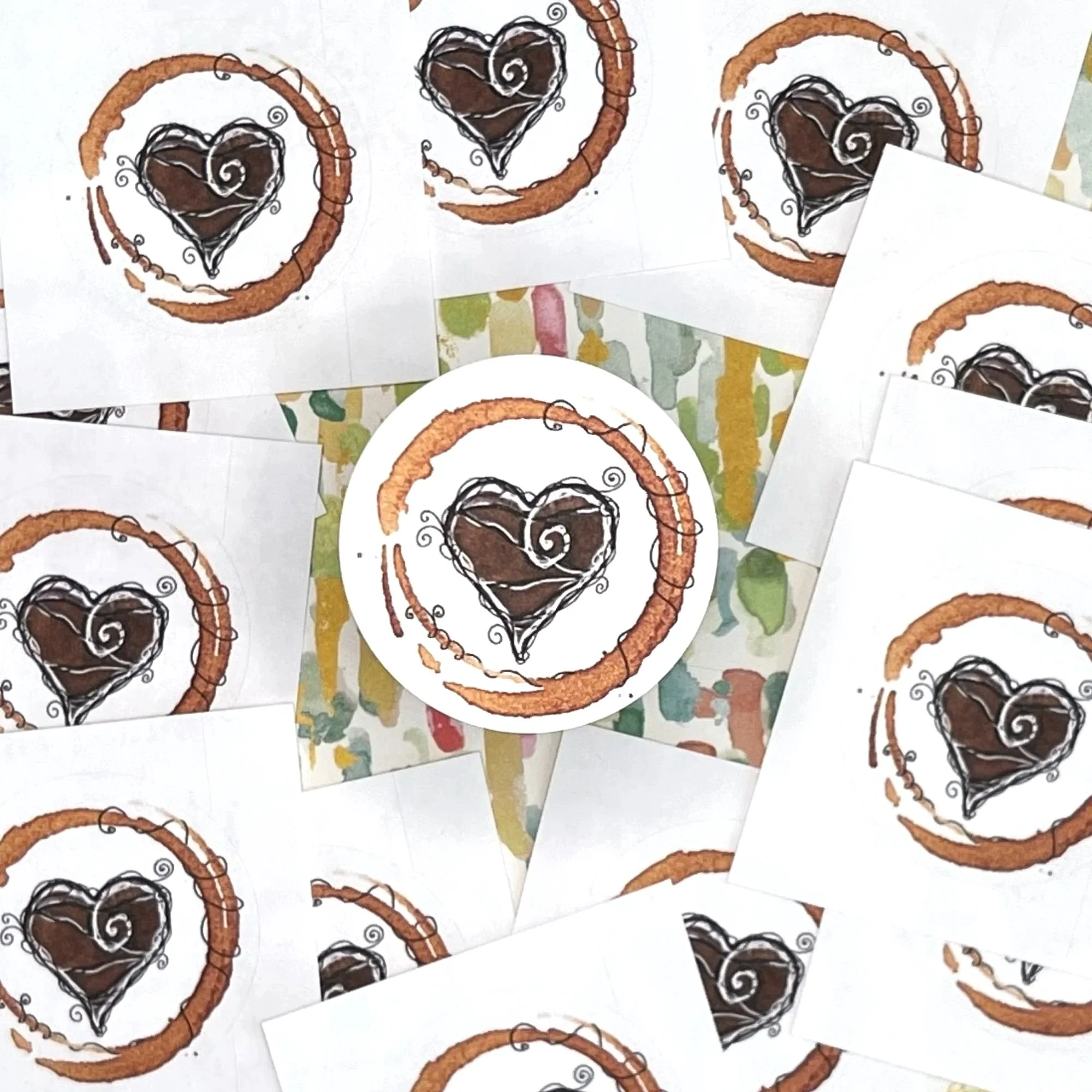 Close-up+of+Latte+Love+envelope+seal+showing+espresso-painted+heart+with+swirling+doodle+lines+and+textured+coffee+stain+ring.jpg