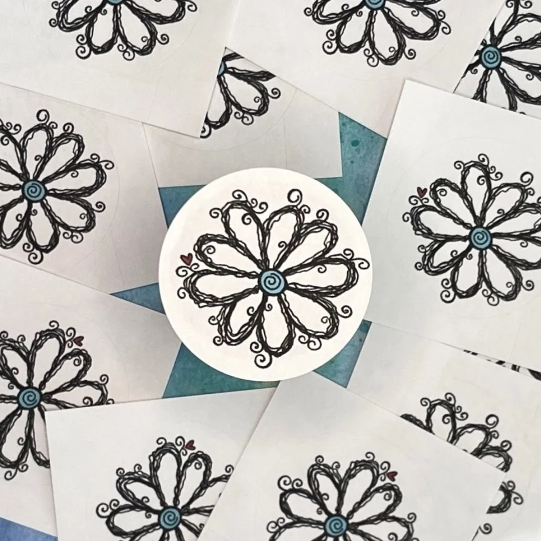 Close-up of WhimZaDaisy showing hand-drawn looping petals, curly accents, and teal spiral center